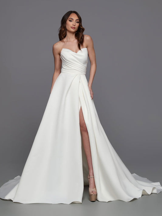 This stunning gown from Davinci Bridal is made from luxe satin and features a strapless faux-wrap bodice with a corset back and a slit maxi skirt for a modern, romantic look. The 50715 is perfect for a bride who wants a timeless style for her special day.  Sizes: 2-20  Colors: Ivory