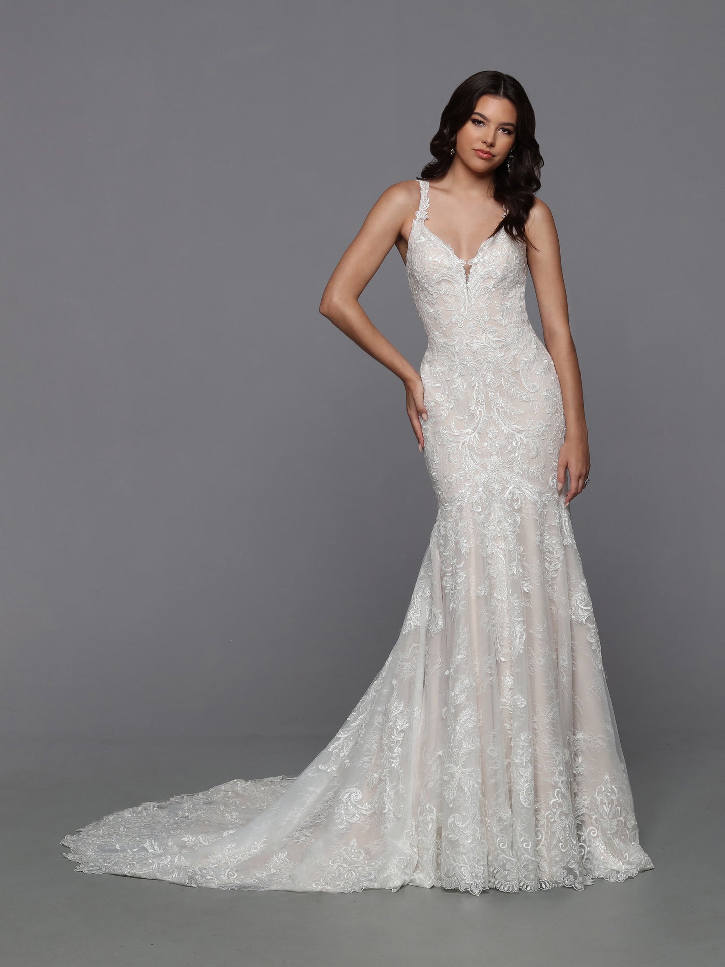 DaVinci Bridal 50783 Mermaid Fit And Flare Lace V-Neck Detachable Train Wedding Gown. What could be better than a delicious lace mermaid wedding dress? A mermaid dress with a removable ball gown bridal skirt! The sheer lace racerback bodice and lace-edged train make this look practically perfect.