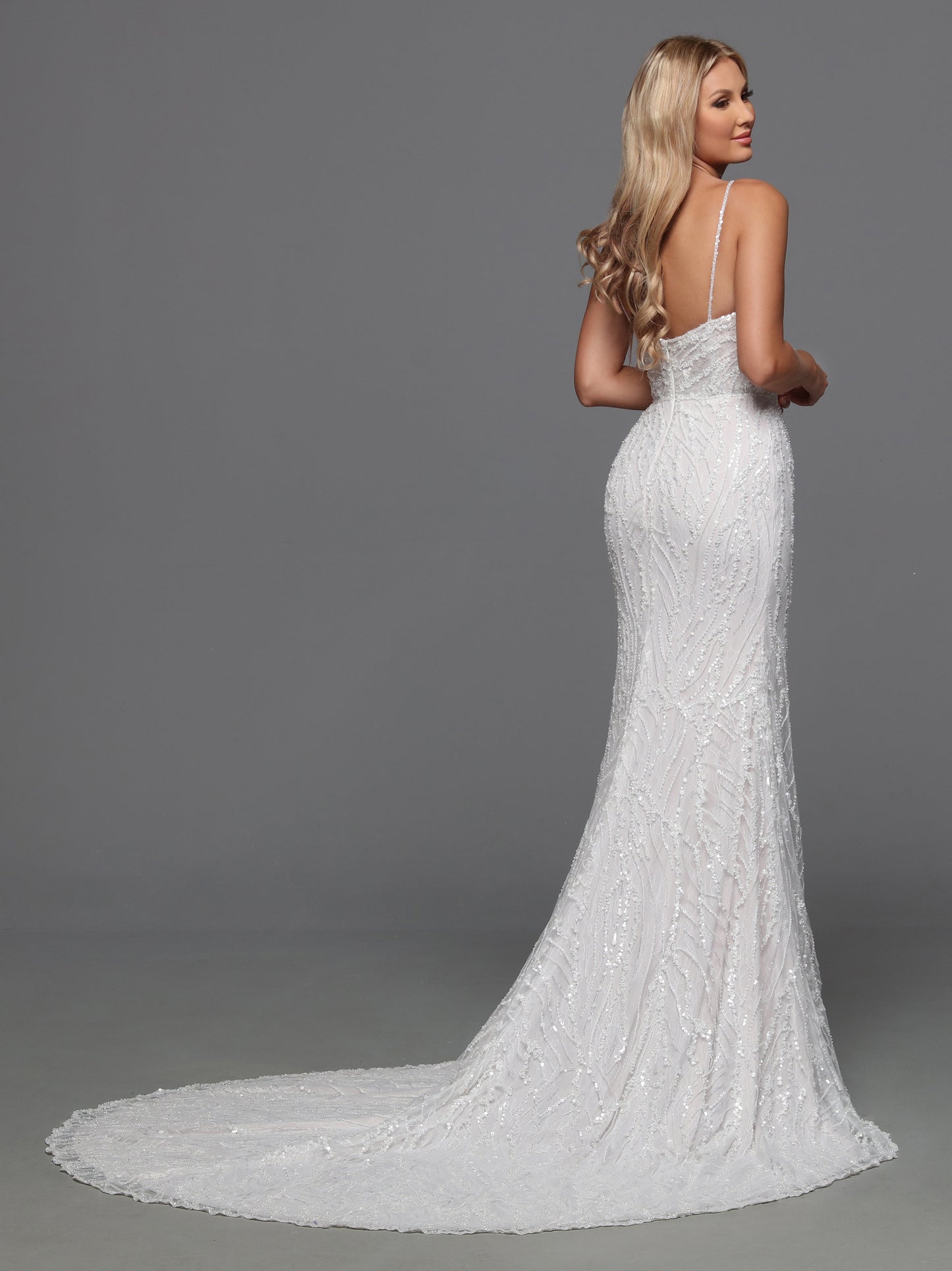 Shimmer and shine on your special day with the Davinci 50841 Sequin Beaded Lace Fitted Wedding Dress. Adorned with glittering sequins and delicate lace, this slip dress features beaded spaghetti straps and a flattering Empire-style waist. Walk down the aisle in style with this elegant and exclusive bridal gown.