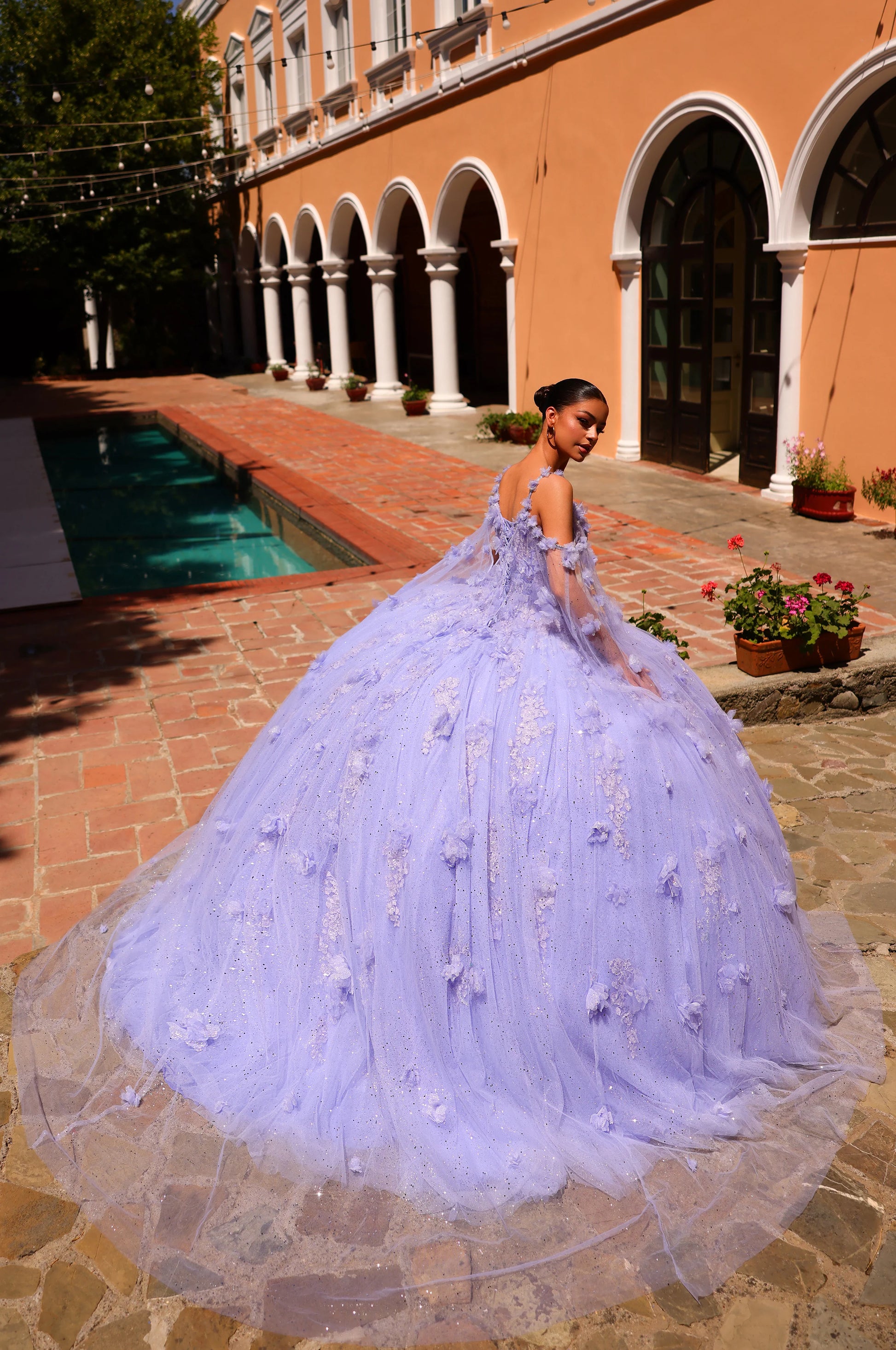 Expertly crafted for your special event, the Amarra 54254 quinceanera Dress features a stunning sequin lace design with a beautiful cape sleeve and intricate 3D flowers. The ball gown train adds a touch of elegance to this must-have dress. Perfect for making a statement and standing out at any occasion.&nbsp;