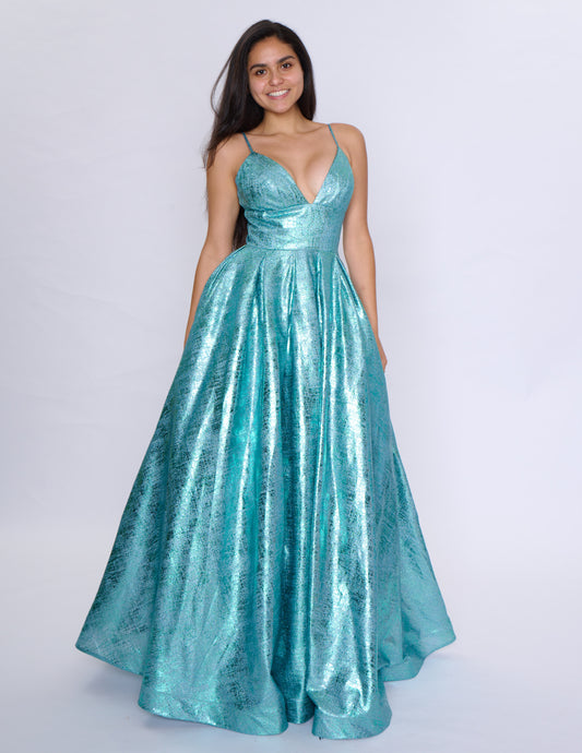 Elevate your formal attire with the Nina Canacci Metallic Ballgown. Stunningly designed with a corset-style bodice and V-neckline, this A-line gown exudes elegance and grace. Made with a metallic fabric, it adds a touch of shimmer to your look. Perfect for prom or any formal event, this dress will make you feel like royalty.

Sizes: 2-18

Colors: Black, Aqua, Rose