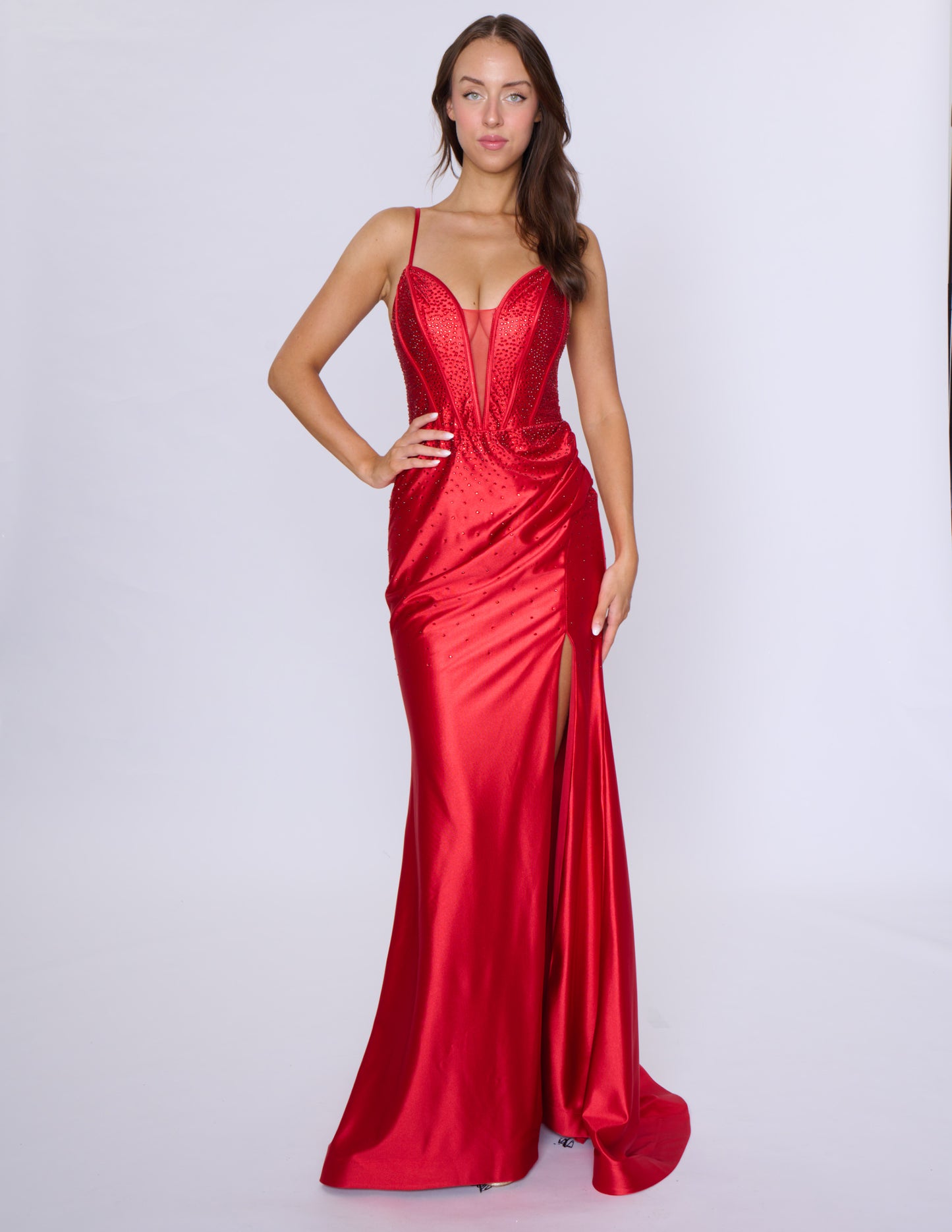 Experience elegance and glamour with our Nina Canacci 6687 long fitted prom dress. Featuring a crystal corset and a V-neck with a tasteful slit, this dress is perfect for formal evening events. Its figure-hugging fit and intricate details will make you stand out and feel confident all night long.

Sizes: 0-16

Colors: Red, Royal, Black, Blue