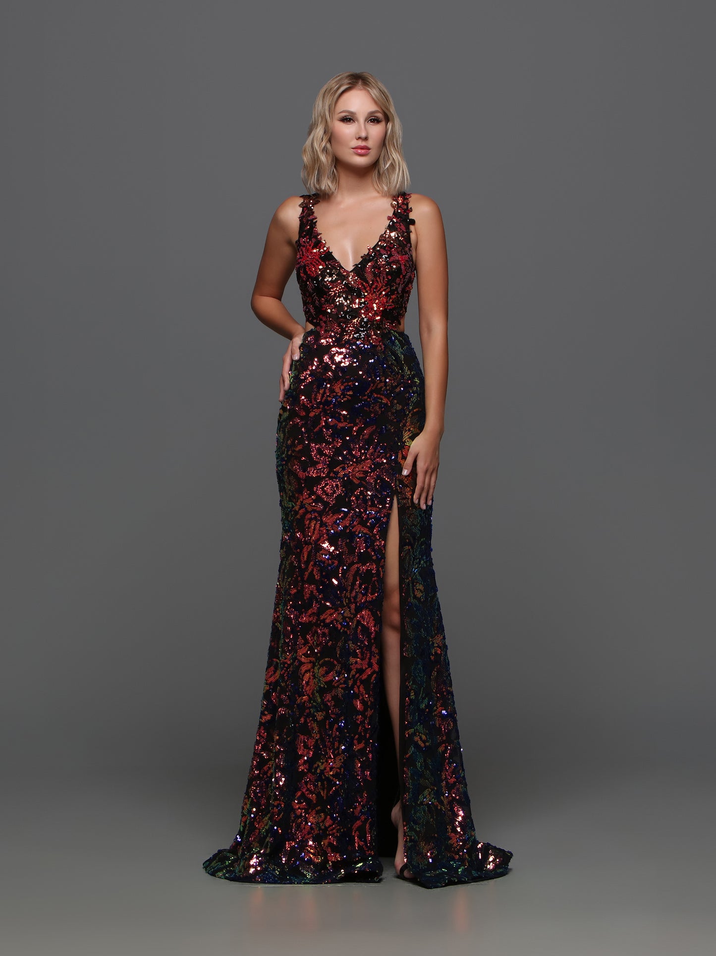 Be the shining star of the prom in the Candice Wang 72372 dress. This fitted sequin gown features a V-neckline, Cutout racerback, and slit for an alluring look. The perfect combination of elegance and edge, this dress is sure to make a statement at any formal event.   Sizes: 0-20  Colors: Black/Multi