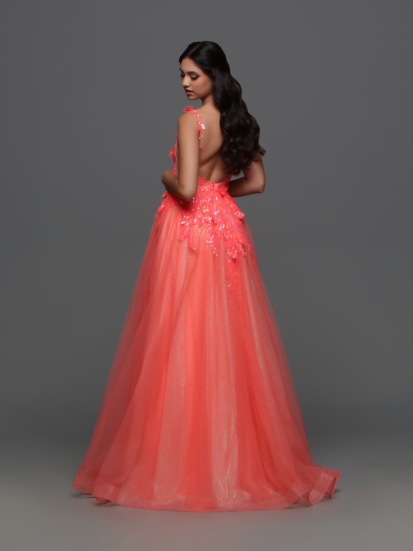 Elevate your formal look with the Candice Wang 72388 Long Shimmer Sequin Ballgown Prom Dress. The A-line silhouette and Glitter tulle details are complemented by the shimmering sequin lace, giving you an undeniable sparkle. Make a statement at your next event with this elegant and stylish dress.  Sizes: 8  Colors: Coral 