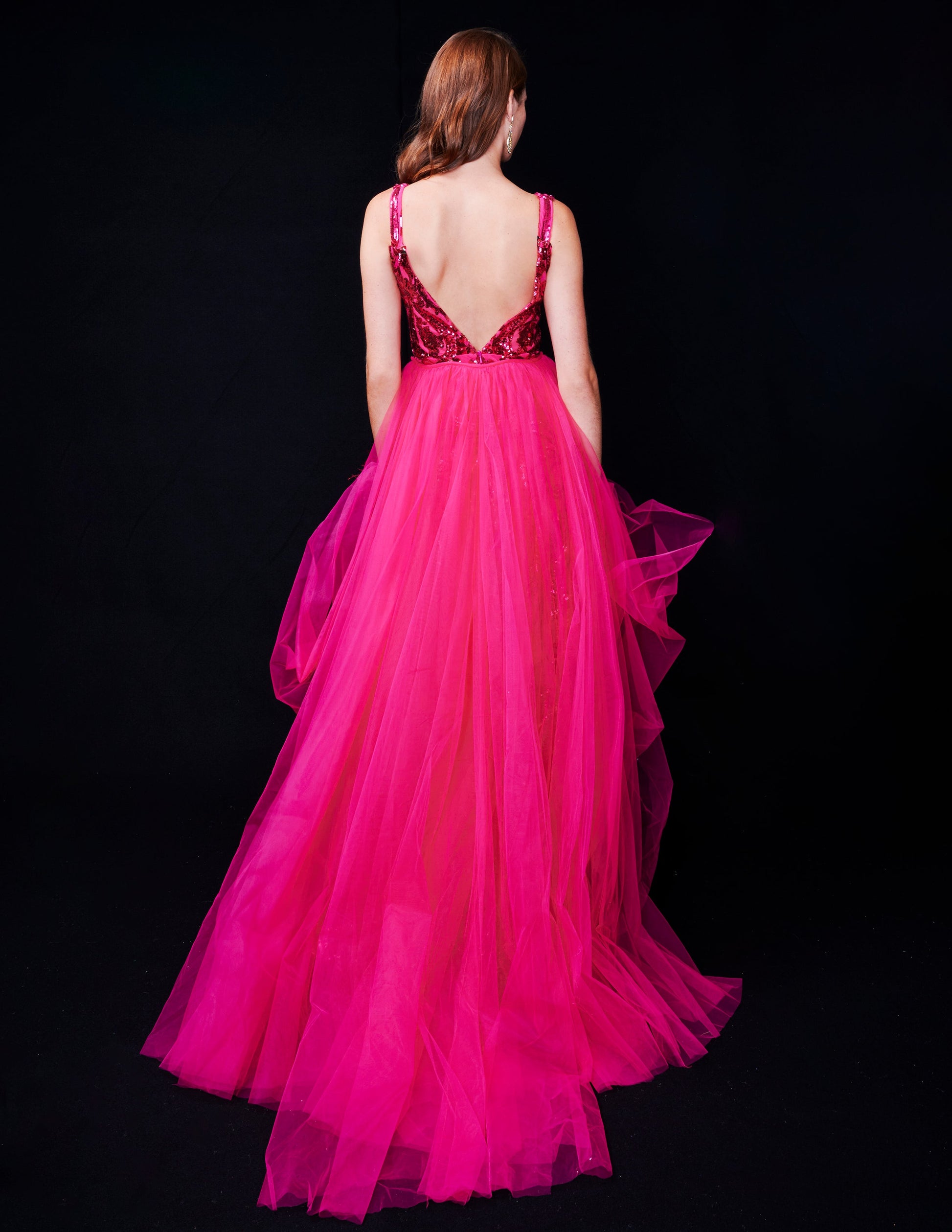 <p data-mce-fragment="1">This stunning Nina Canacci 8224 long, fitted pageant dress features a dazzling sequin design and a detachable tulle overskirt with a feather cuff. The elegant V-neckline adds a touch of sophistication to this show-stopping gown. Perfect for any formal event or pageant, this dress is sure to make a statement.</p> <p data-mce-fragment="1">&nbsp;</p>