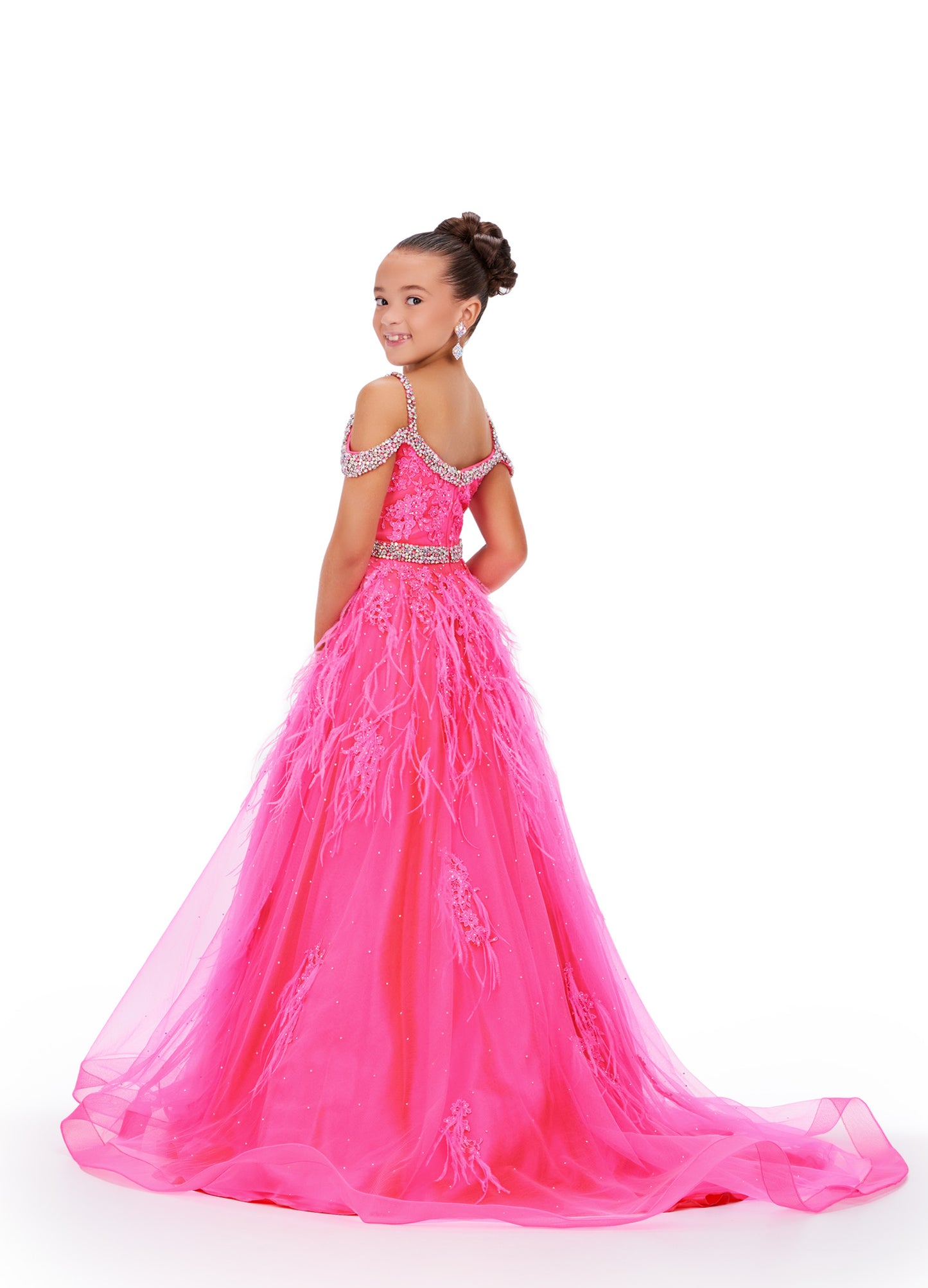 Experience the epitome of elegance and grace with the Ashley Lauren Kids 8242 Girls Lace Feather Pageant Dress. Featuring delicate lace and stunning feather accents, this off the shoulder ballgown is the perfect choice for any special occasion. Its impeccable design and craftsmanship will make your little girl feel like a true princess. This gorgeous kids gown is embellished with crystal beaded straps, neckline trim and belt. The dress is adorned with lace applique, press on stones and feather accents.