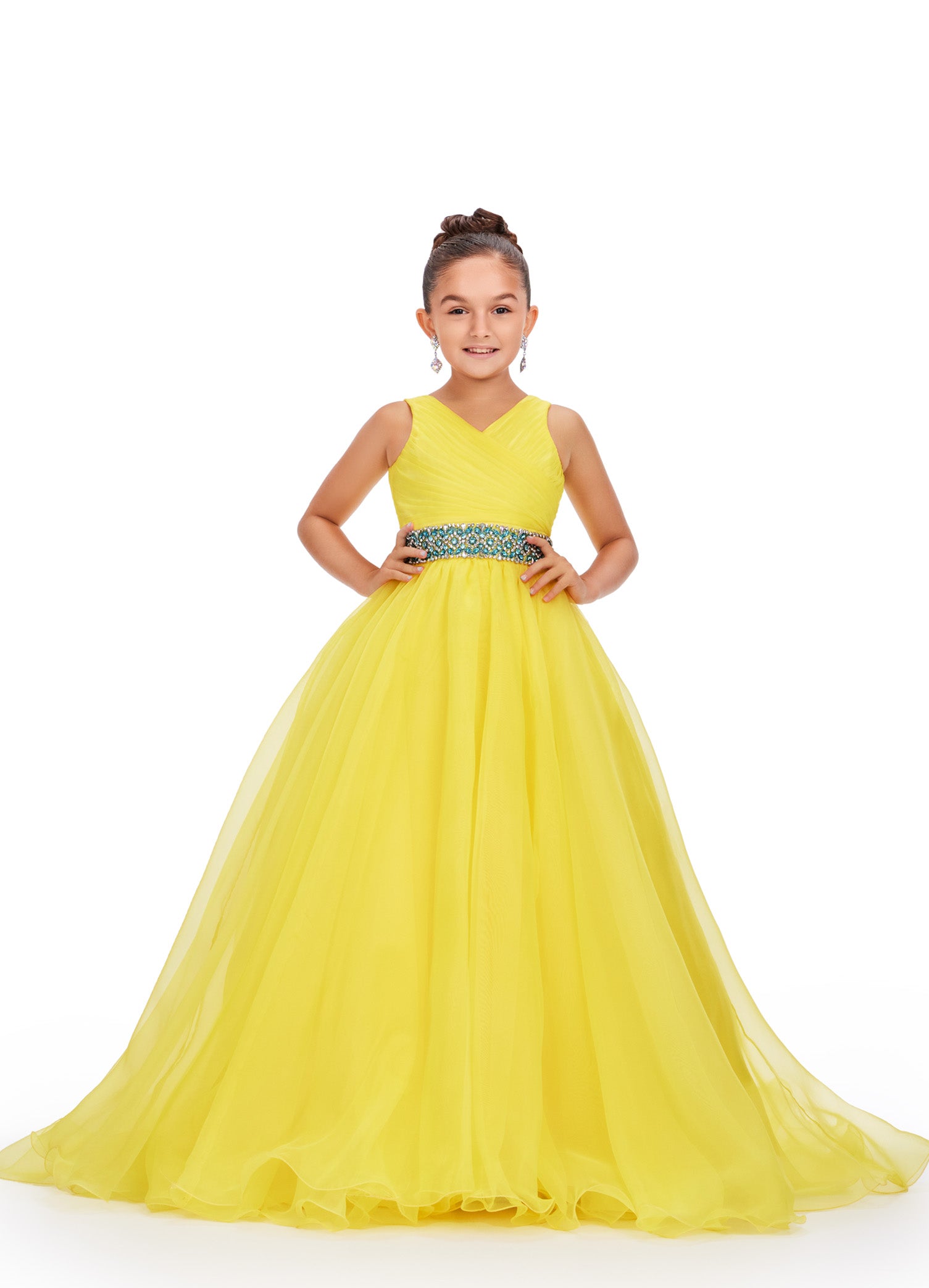 Expertly designed for young pageant contestants, the Ashley Lauren Kids 8249 dress combines a classic A-line silhouette with a modern V-neckline and sparkling crystal belt. Made from luxurious organza fabric, this dress is both elegant and comfortable, ensuring your child will look and feel their best on stage.