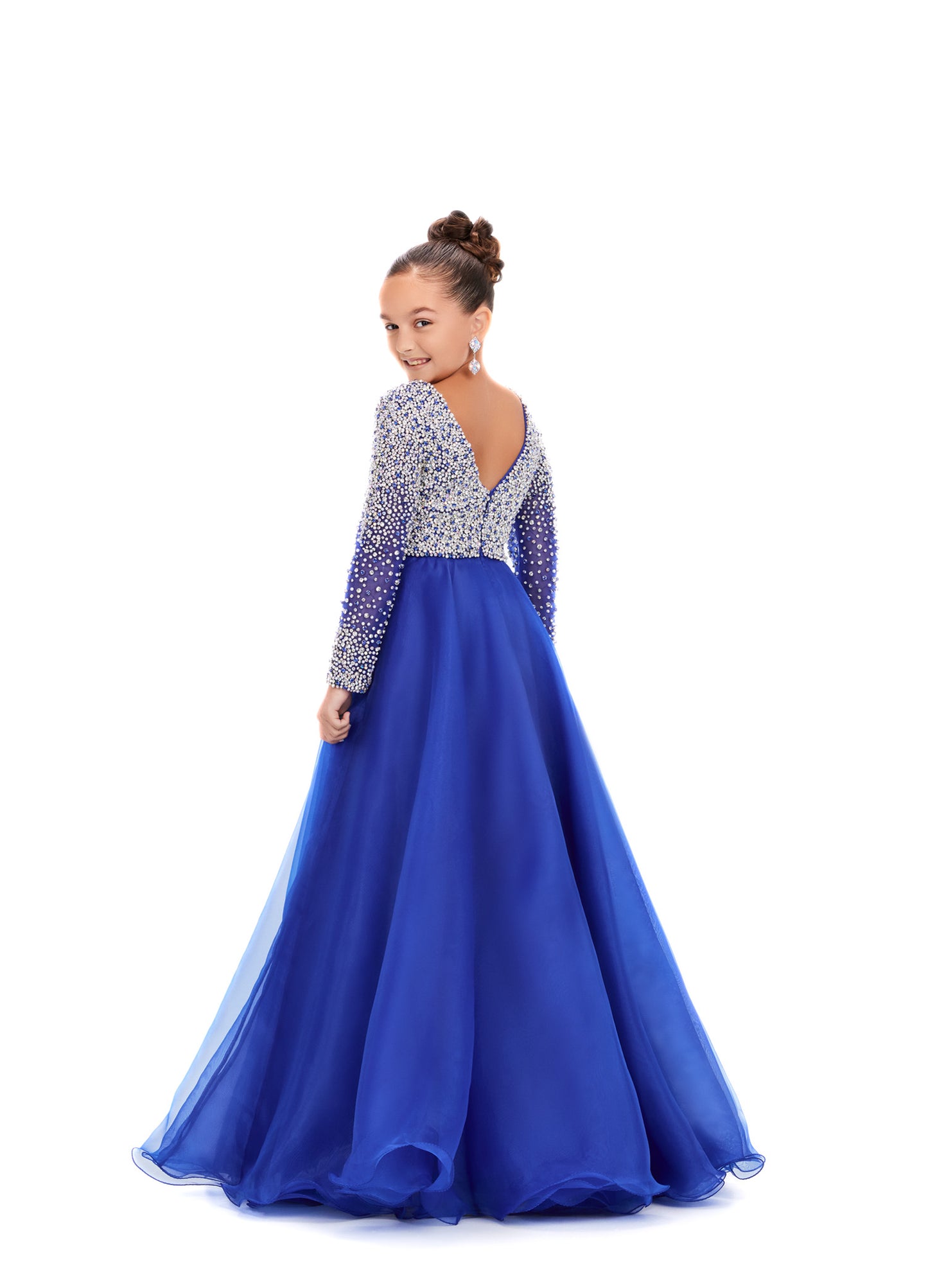 Elevate your little girl's style with this stunning Ashley Lauren Kids 8271 Pageant Dress. The intricate beaded details and long sleeve design add elegance and grace to the A-line silhouette, making her stand out on stage. Crafted with high-quality materials, this dress ensures unbeatable comfort and lasting wear. This elegant kids organza gown features a v-neckline with crystal and pearl details. The look is completed with long sleeves and an a-line skirt.