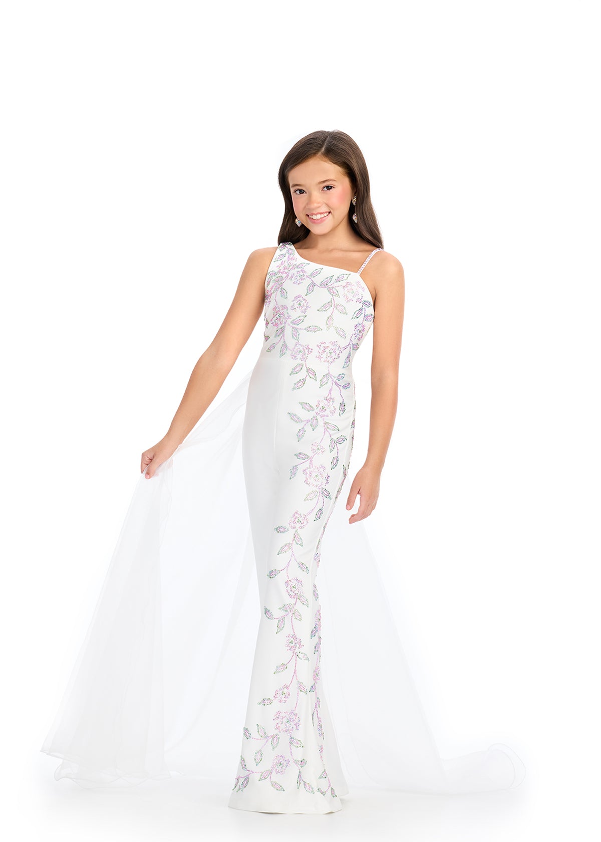 The Ashley Lauren 8274 Jersey Girls Jumpsuit is a stunning piece that features a unique embellished design with stones, combined with an elegant overskirt on one side. Perfect for making a statement at any event, this jumpsuit offers both style and comfort.