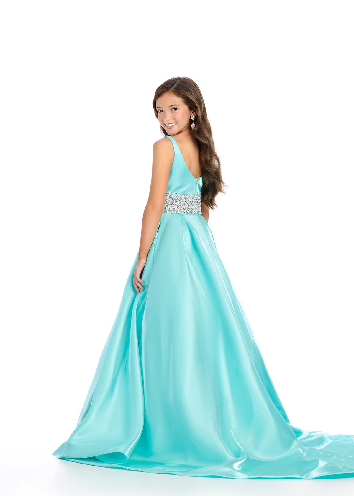 Indulge in luxury and sophistication with the Ashley Lauren 8276 Girls Satin Ballgown. This exquisite piece features a beautiful satin fabric that flows effortlessly, while the embellished crystal waistline adds a touch of glamour. Perfect for your little princess, this ballgown will make her feel like royalty.