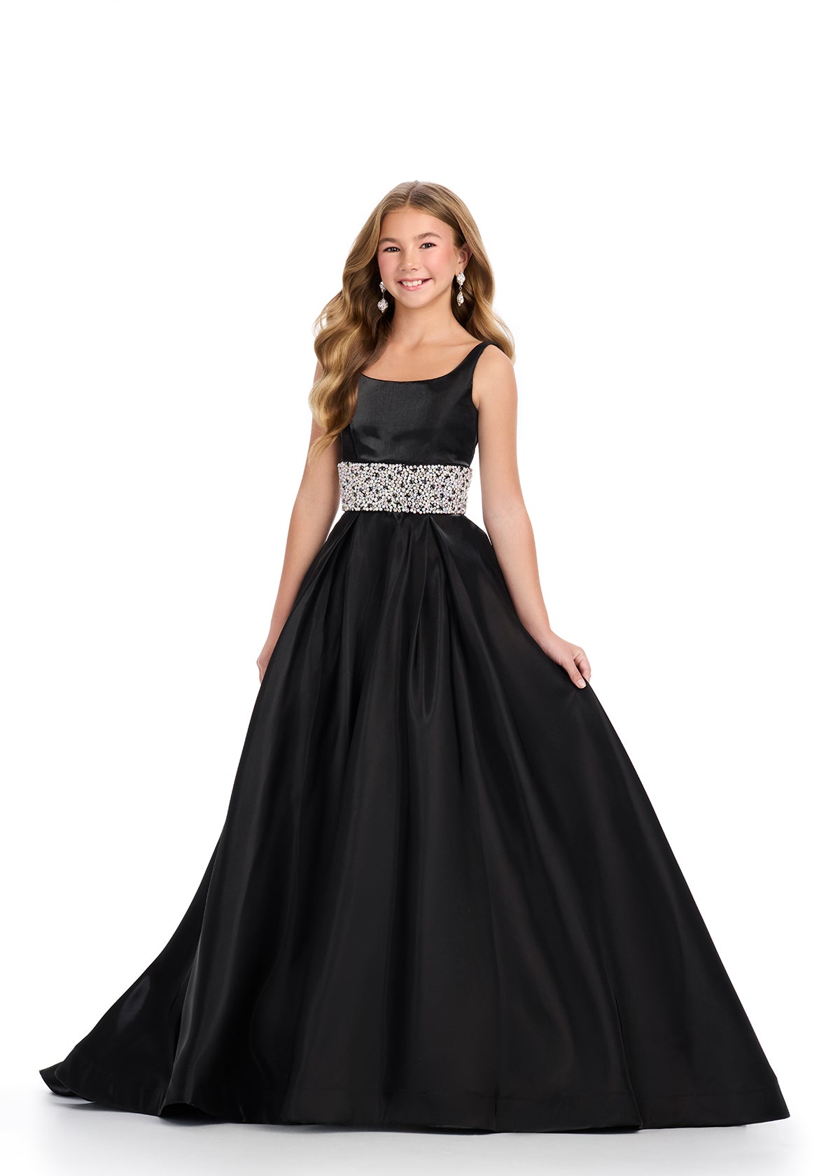 Indulge in luxury and sophistication with the Ashley Lauren 8276 Girls Satin Ballgown. This exquisite piece features a beautiful satin fabric that flows effortlessly, while the embellished crystal waistline adds a touch of glamour. Perfect for your little princess, this ballgown will make her feel like royalty.