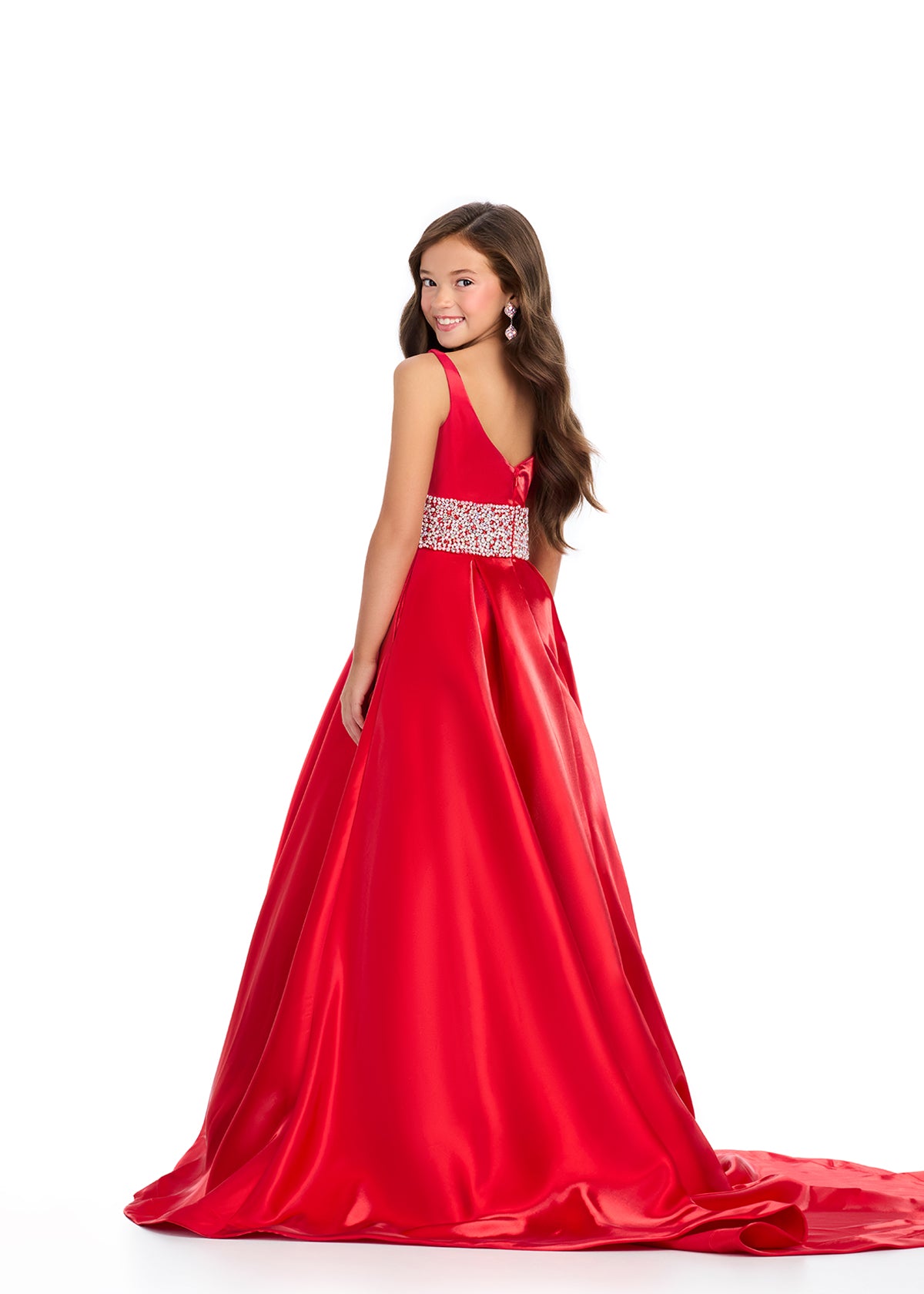 Indulge in luxury and sophistication with the Ashley Lauren 8276 Girls Satin Ballgown. This exquisite piece features a beautiful satin fabric that flows effortlessly, while the embellished crystal waistline adds a touch of glamour. Perfect for your little princess, this ballgown will make her feel like royalty.