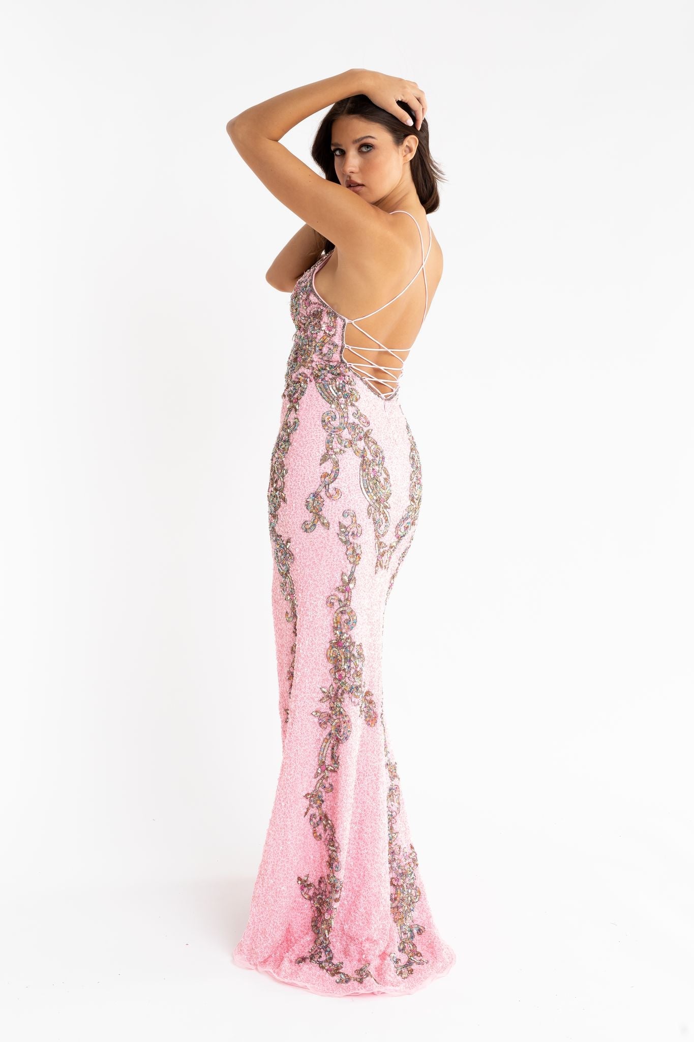 Primavera Couture 3211 baby pink is a Long fitted sequin Embellished Formal Evening Gown. This Prom Dress Features a deep V Neck with an open Corset lace up back. Beaded & embellished elegant scroll pattern accentuate curves. Fully beaded prom dress with floral pattern and side slit. Long Sequin Gown featuring a v neckline. slit in the fitted skirt, Slit in Thigh. Stunning Pageant Dress, Prom Gown & More!