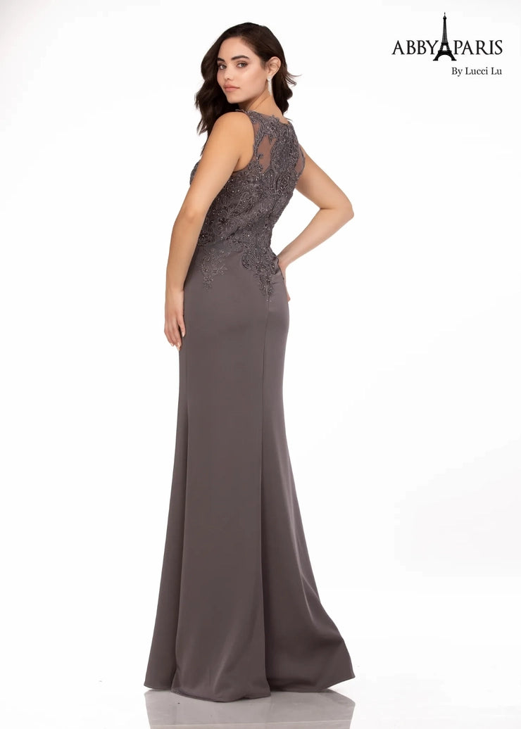 Abby Paris 96061W Lace Bodice Stretch Crepe A-Line High Neck Plus Size MOB Formal Gown. Glam up your special occasion with the Abby Paris 96061W Lace Bodice Stretch Crepe A-Line High Neck Plus Size MOB Formal Gown. This beautiful dress is designed with a lace bodice made of stretch crepe for a comfortable fit and features a high neck, A-Line silhouette, and beaded waist. Perfect for weddings or formal events.