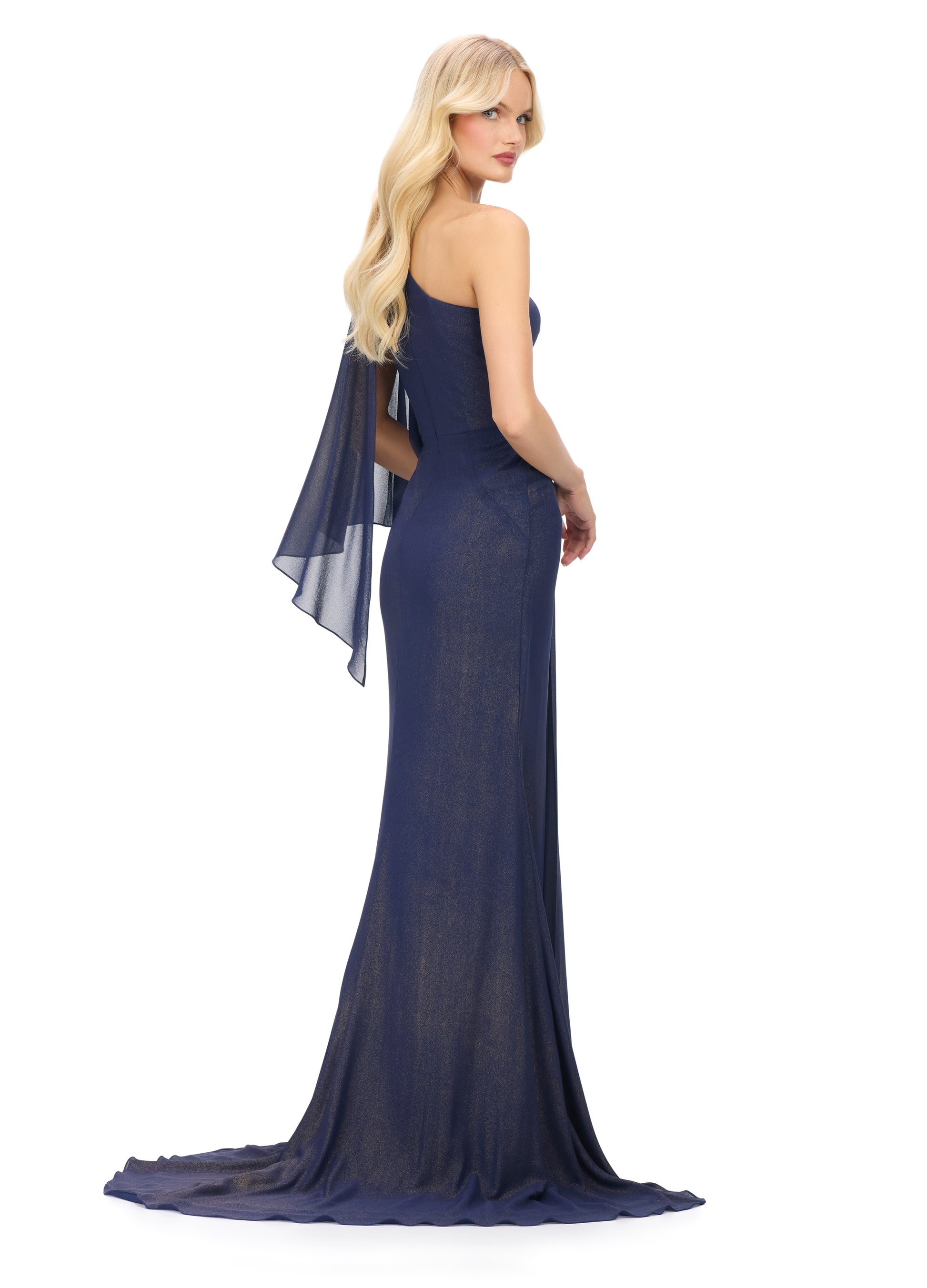 The Ashley Lauren 11701 evening gown boasts a one shoulder design with a single flowy chiffon sleeve, a ruched waist, and an embellished shoulder. This elegant and sophisticated dress is perfect for any special occasion, providing a flattering silhouette and eye-catching details. Elevate your evening look with this stunning piece.