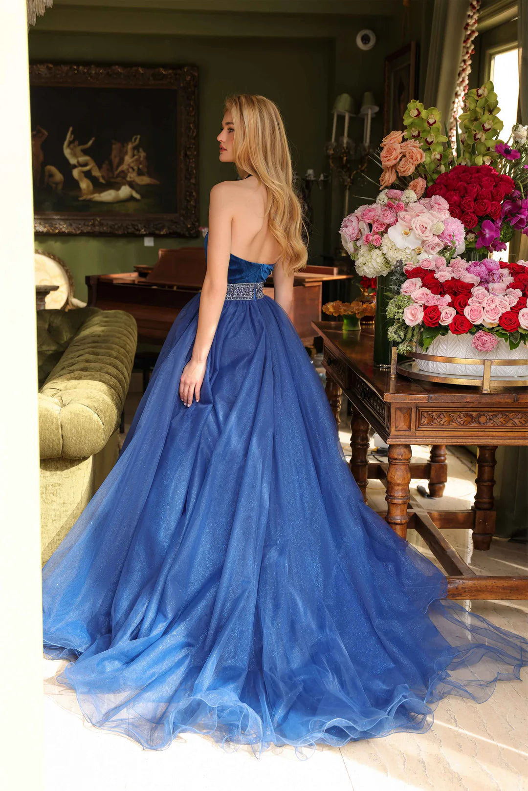 Be the center of attention in the stunning Ava Presley 39850 pageant dress. The velvet bodice with crystal belt adds a touch of elegance, while the glitter Lush A Line Tulle wire hem skirt makes a bold statement. Perfect for prom, homecoming, or any formal event.  Sizes: 00-14  Colors: Fuchsia, Peacock, Royal