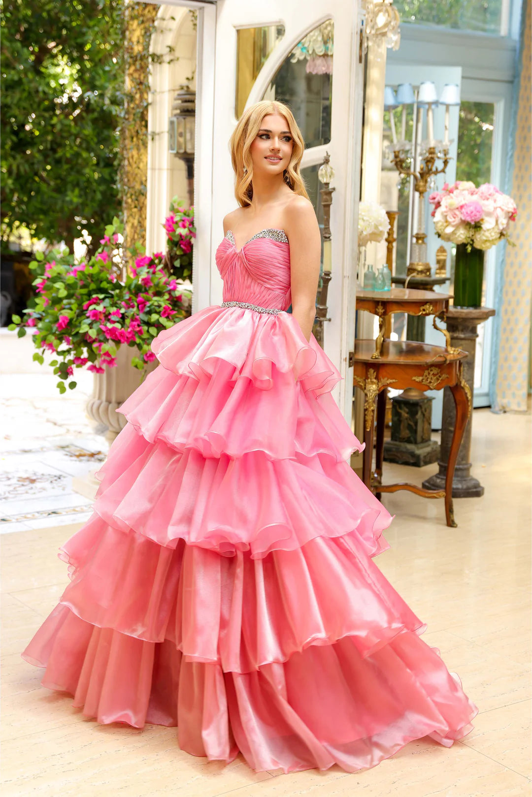 Indulge in luxury with the Ava Presley 29546 Long Layered Prom Dress. This stunning ballgown features a strapless A-line silhouette and sparkling crystal detailing. Perfect for prom or a pageant, this dress will make you feel like royalty. Step into elegance with the Ava Presley 29546