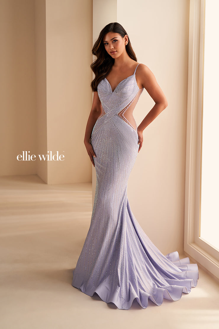 This Ellie Wilde formal dress is perfect for any prom or special event. The fitted crystal jersey construction features sheer mesh cutouts on the sides and a backless mermaid design for a perfect fit. It's finished with a low v-neck for a timeless look.

COLOR:&nbsp;BLACK, LIGHT BLUE, NAVY BLUE, ROYAL BLUE, HOT PINK, RUBY, IRIS, LAVENDER FROST, SAKURA PINK, EMERALD, MACADAMIA
SIZE:&nbsp;00 - 20