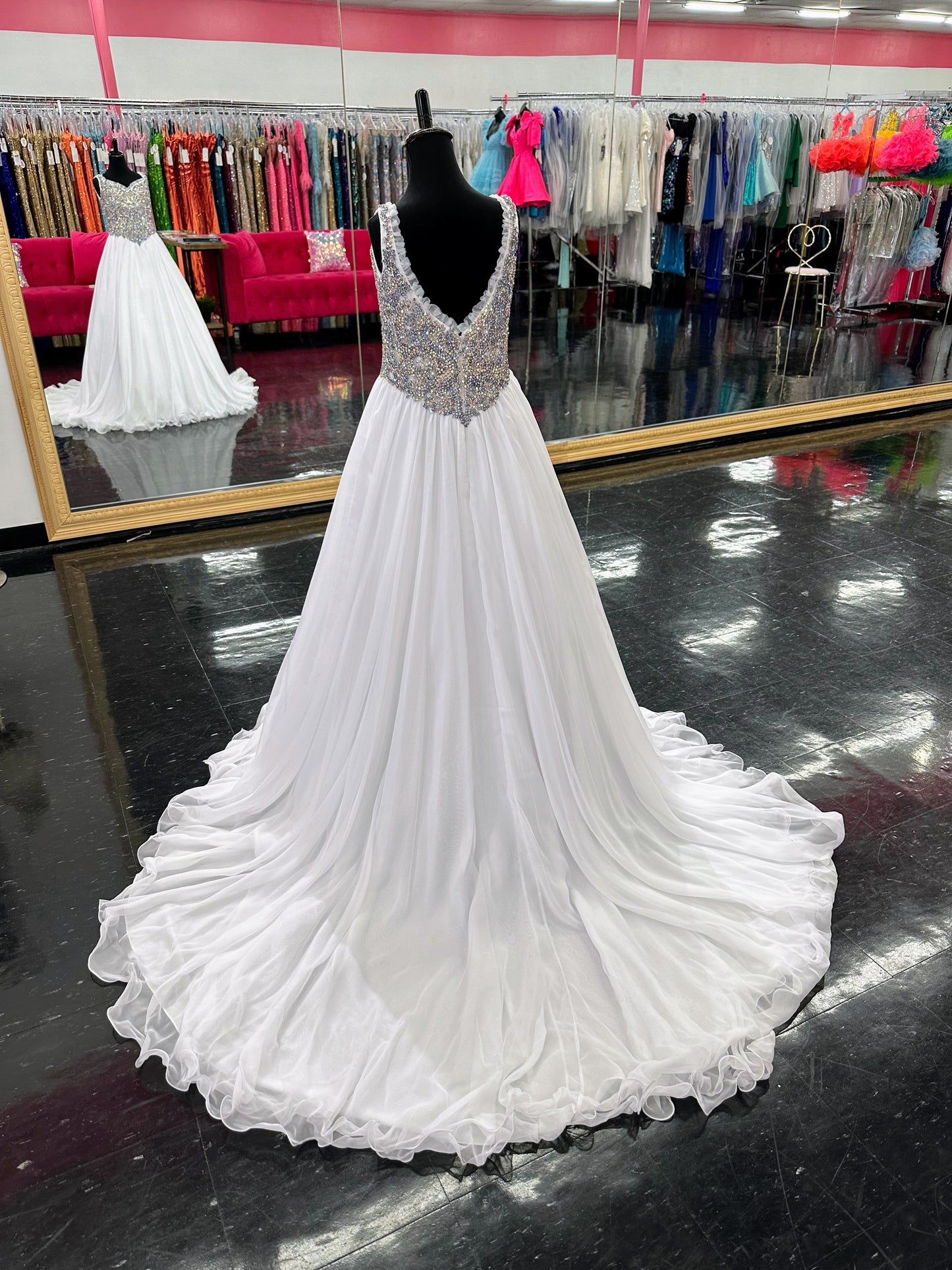 Experience the luxurious elegance of the Samantha Blake 1127 Pageant Dress. Made with soft, lightweight chiffon, this A-line ballgown will have your little girl feeling like a true princess. The crystal embellished bodice and ruffle trim neckline add a touch of sparkle and charm. Perfect for any pageant or special occasion.