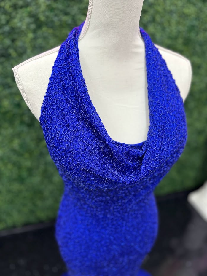 Johnathan Kayne 2728 is a size 4 cowl neck formal gown crafted with Custom Liquid Beading. The halter neck closure makes for a beautiful and stylish silhouette with a royal finish. Perfect for your next event!   ** One of a kind Custom  Size: 4  Color: Royal