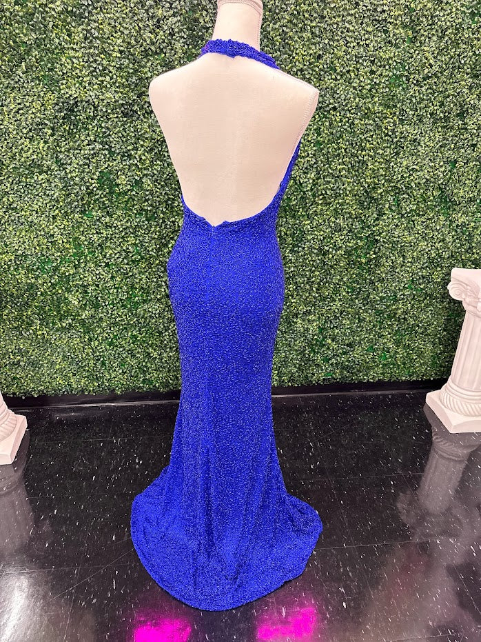 Johnathan Kayne 2728 is a size 4 cowl neck formal gown crafted with Custom Liquid Beading. The halter neck closure makes for a beautiful and stylish silhouette with a royal finish. Perfect for your next event!   ** One of a kind Custom  Size: 4  Color: Royal