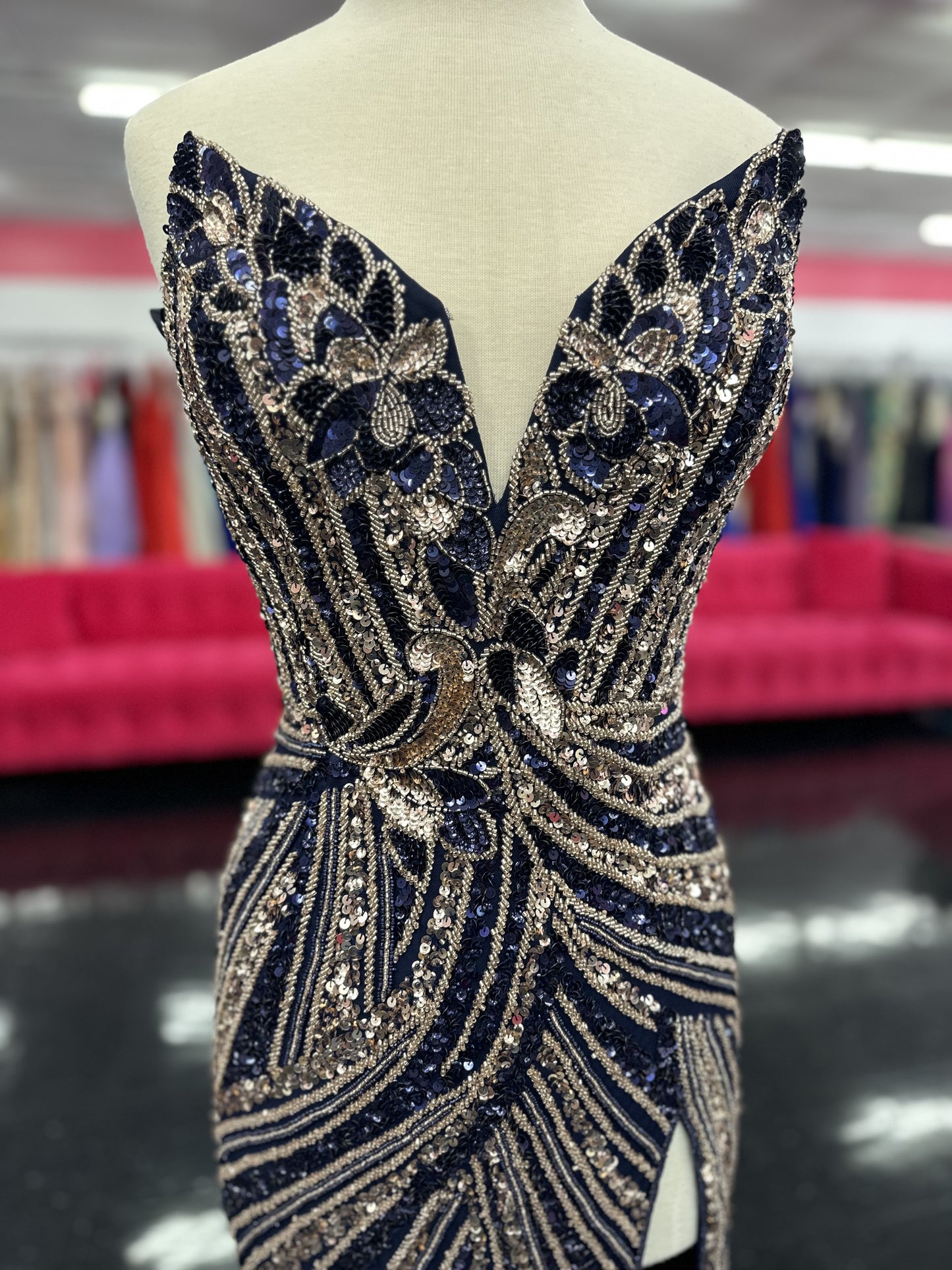 Ashley Lauren 11236 Long Fitted V Neck Slit Beaded Sequin Prom Dress Pageant Gown This strapless gown is sure to turn heads. The sweetheart neckline is complete with a modern floral sequin motif that continues down the bustier and skirt. The skirt is complete with a left leg slit.