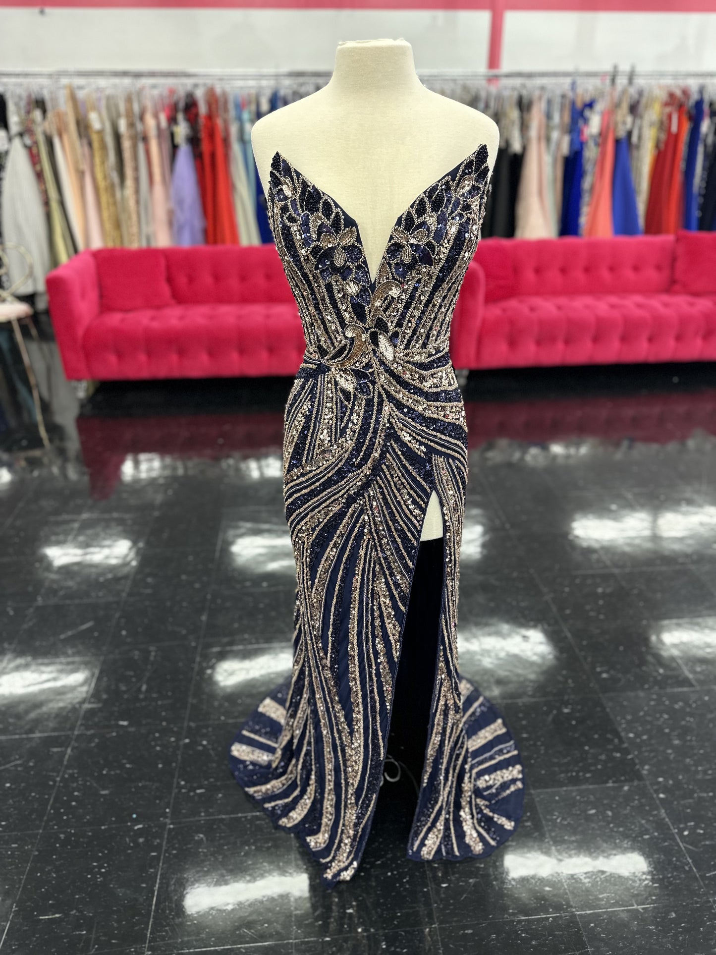 Ashley Lauren 11236 Long Fitted V Neck Slit Beaded Sequin Prom Dress Pageant Gown This strapless gown is sure to turn heads. The sweetheart neckline is complete with a modern floral sequin motif that continues down the bustier and skirt. The skirt is complete with a left leg slit.