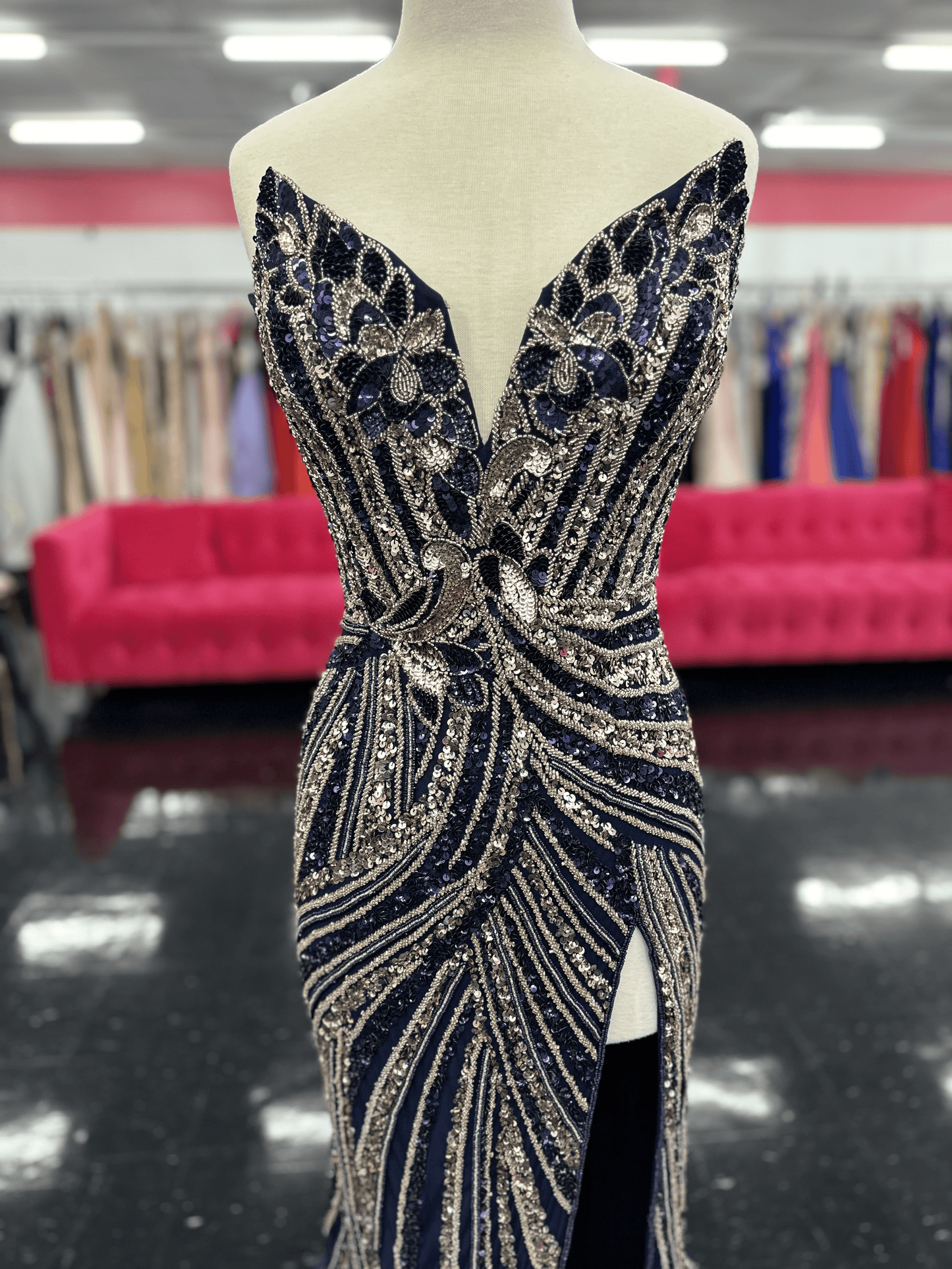 Ashley Lauren 11236 Long Fitted V Neck Slit Beaded Sequin Prom Dress Pageant Gown This strapless gown is sure to turn heads. The sweetheart neckline is complete with a modern floral sequin motif that continues down the bustier and skirt. The skirt is complete with a left leg slit.