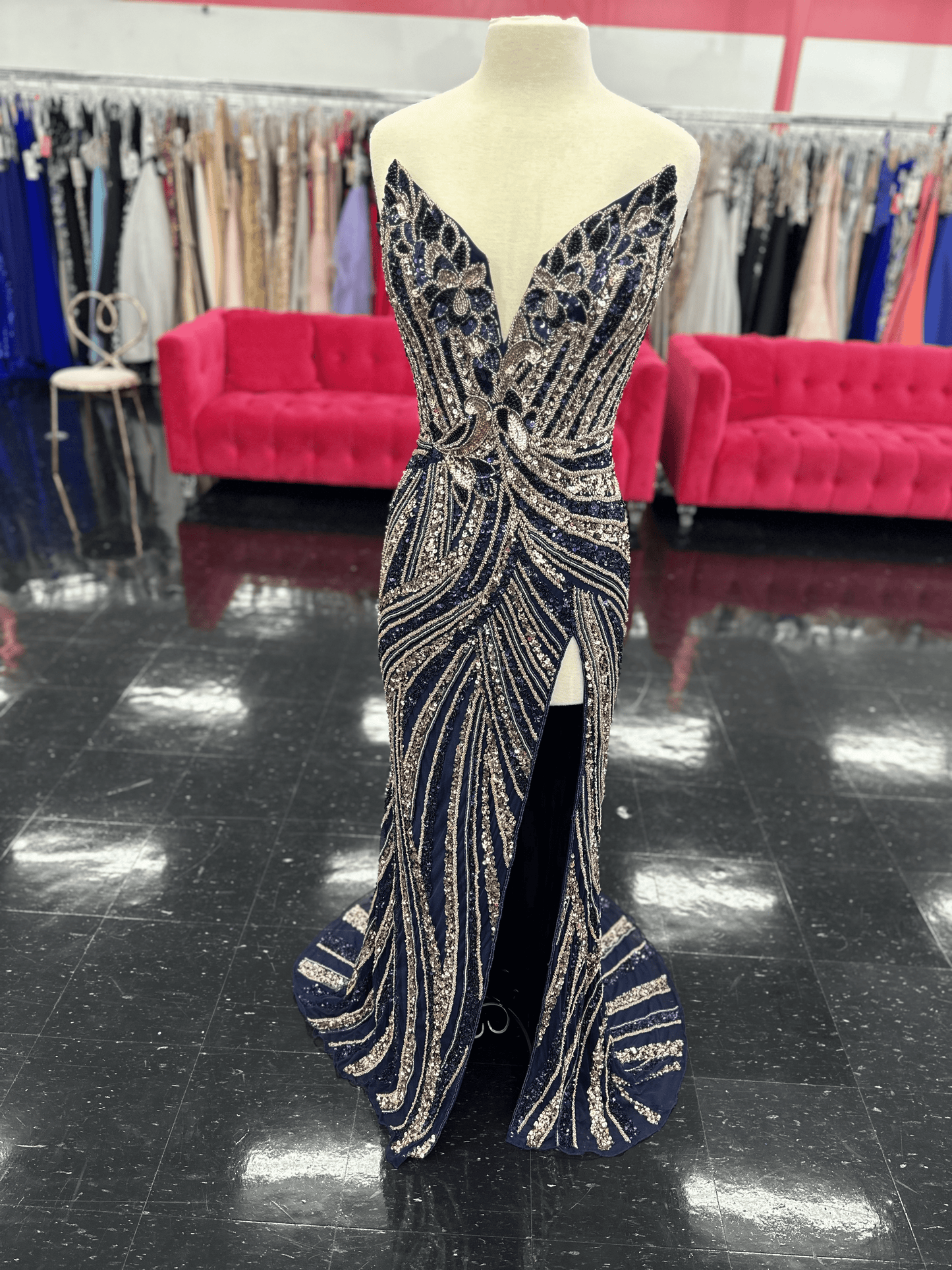 Ashley Lauren 11236 Long Fitted V Neck Slit Beaded Sequin Prom Dress Pageant Gown This strapless gown is sure to turn heads. The sweetheart neckline is complete with a modern floral sequin motif that continues down the bustier and skirt. The skirt is complete with a left leg slit.