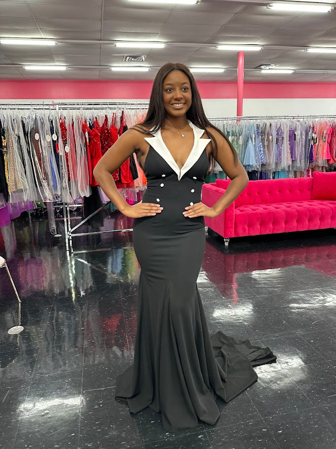 Elevate your evening attire with the Johnathan Kayne 1442 Size 4 Black Long Tuxedo Dress. This classy gown features a sleek tuxedo design, perfect for formal events or pageants. Its black color adds a touch of elegance, while the long length provides a sophisticated silhouette. Stand out from the crowd in style and confidence.