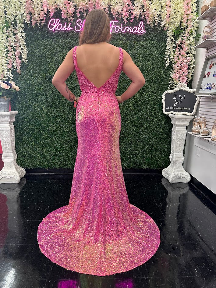 Expertly crafted by Jovani, the JVN36580 Prom Dress is a stunning masterpiece. With a sheer lace V-neck, sequin detailing, and a thigh-high slit, this formal evening gown exudes elegance and sophistication. Perfect for any formal occasion, this dress is sure to make a statement.  Sizes: 00-24  Colors: Lilac, Hot Pink, Light Blue