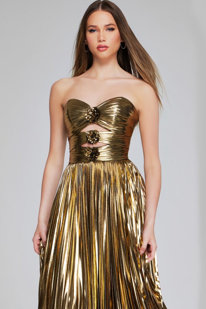 Dazzle in this stunning Jovani 42335 Pleated Metallic Strapless Dress. With intricate pleating and a cut-out design, this elegant dress exudes sophistication. Perfect for a formal event or prom, its metallic fabric catches the light for a sparkling effect. Stun in this figure-flattering gown and make a statement.