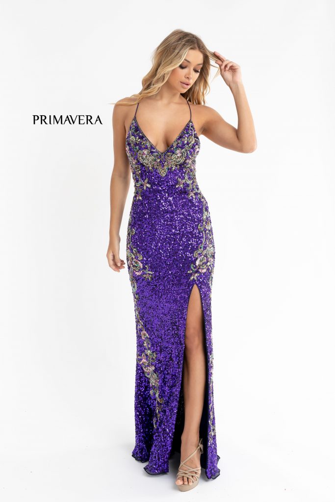 Primavera Couture 3211 Purple is a Long fitted sequin Embellished Formal Evening Gown. This Prom Dress Features a deep V Neck with an open Corset lace up back. Beaded & embellished elegant scroll pattern accentuate curves. Fully beaded prom dress with floral pattern and side slit. Long Sequin Gown featuring a v neckline. slit in the fitted skirt, Slit in Thigh. Stunning Pageant Dress, Prom Gown & More! front