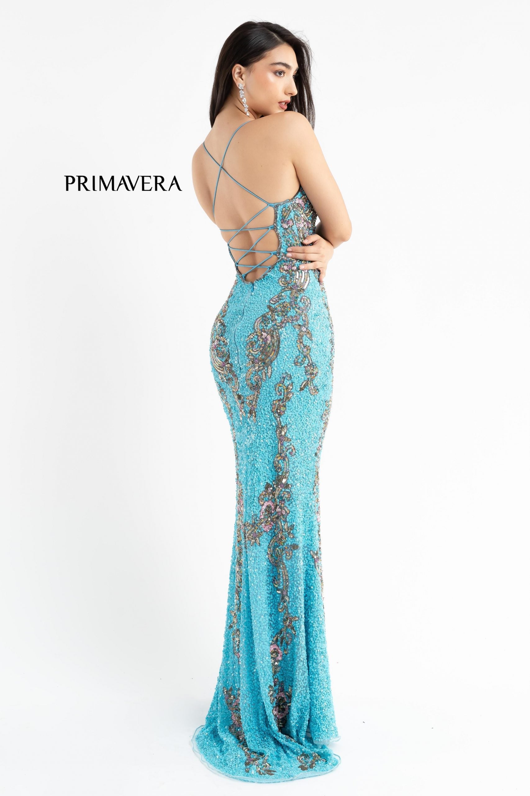 Primavera Couture 3211 is a Long fitted sequin Embellished Formal Evening Gown. This Prom Dress Features a deep V Neck with an open Corset lace up back. Beaded & embellished elegant scroll pattern accentuate curves. Fully beaded prom dress with floral pattern and side slit. Long Sequin Gown featuring a v neckline. slit in the fitted skirt, Slit in Thigh. Stunning Pageant Dress, Prom Gown & More!