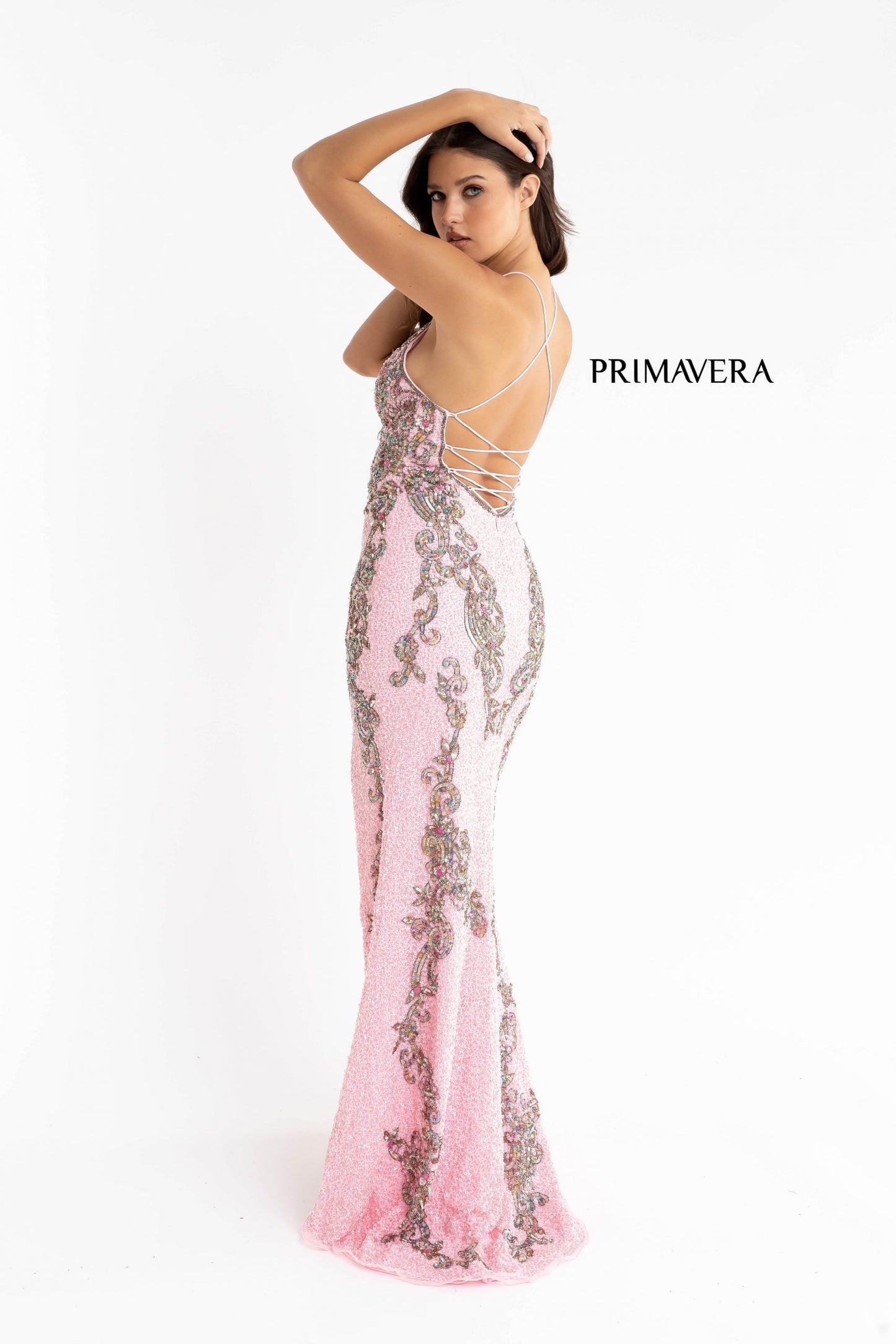 Primavera Couture 3211 baby pink is a Long fitted sequin Embellished Formal Evening Gown. This Prom Dress Features a deep V Neck with an open Corset lace up back. Beaded & embellished elegant scroll pattern accentuate curves. Fully beaded prom dress with floral pattern and side slit. Long Sequin Gown featuring a v neckline. slit in the fitted skirt, Slit in Thigh. Stunning Pageant Dress, Prom Gown & More!