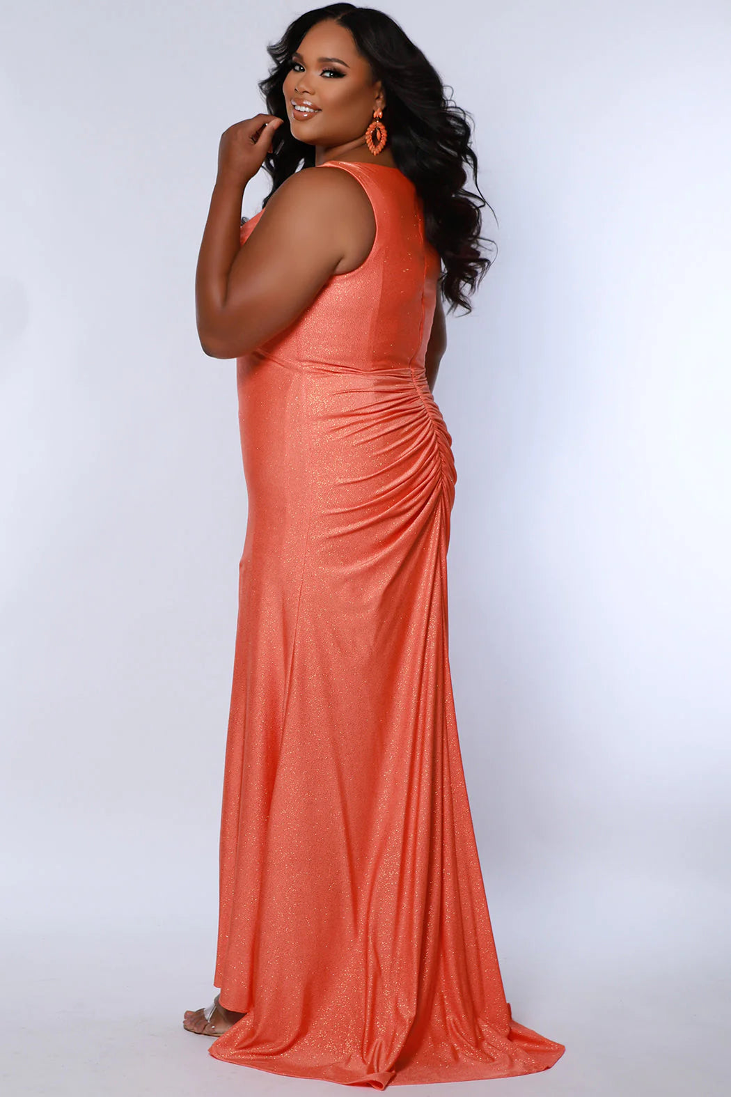 This Sydneys Closet SC7369 Plus Size Prom Dress will make you look amazing at your formal event. It features a stunning V neckline, with an elegant ruched back and a slit train. The fabric is comfortable and the slim fit is designed to flatter curves. Make a lasting impression at your special event! 