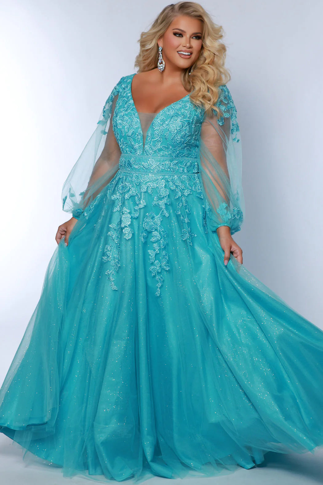 Turn heads in Sydneys Closet SC7373 Long Prom Dress. The sequin and plus size puff sleeves make this A-Line formal gown remarkably elegant, while the plush material provides maximum comfort for your special night. Make a statement with this beautiful dress. You will look pretty fancy at Prom 2024 or any special event when you opt to wear this plus size formal dress with sleeves.