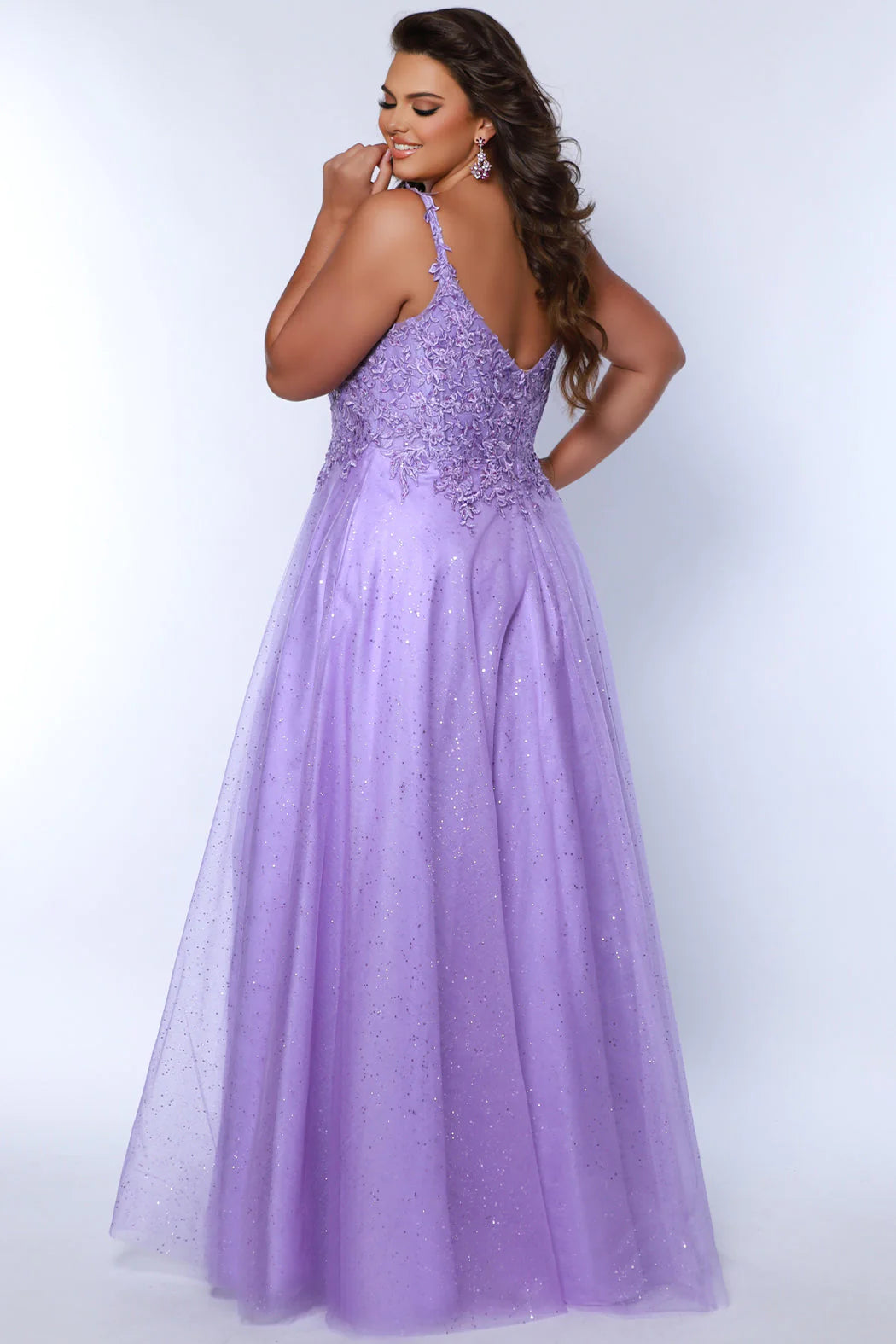 Look stunning at any formal event in a Sydneys Closet SC7384 Long Prom Dress. This A-line prom gown features a V-neckline with a scoop back, slit, pockets and a floor-length skirt complete the look. Ideal for plus size formal occasions. Pump up the fun factor at Prom 2024 when you arrive wearing this sparkly Aline evening dress. 