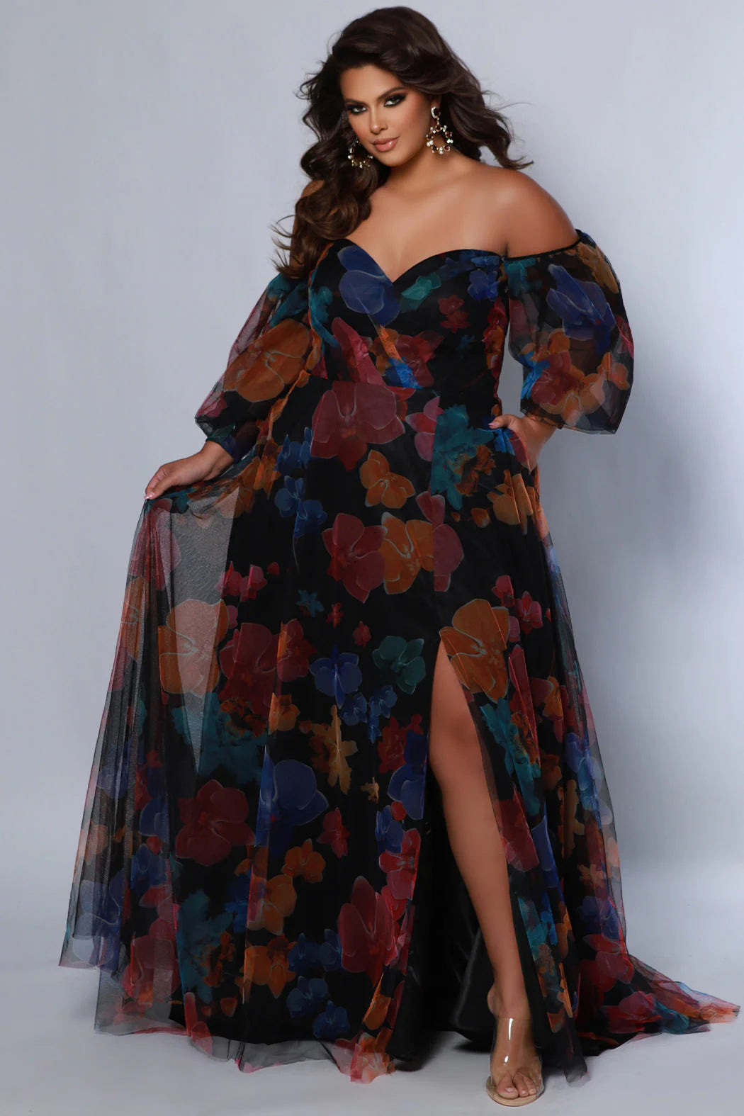 Elevate your special occasion look with this stunning Sydneys Closet SC7386 gown. Crafted with a beautiful A-line silhouette, this plus-size dress features floral digital print, alluring slit optional puff sleeves, pockets and a train. From prom to formal events, you will look and feel glamorous. Look like a breath of fresh air hen you wear our floral plus size maxi dress as a wedding guest or to any fancy formal event. 