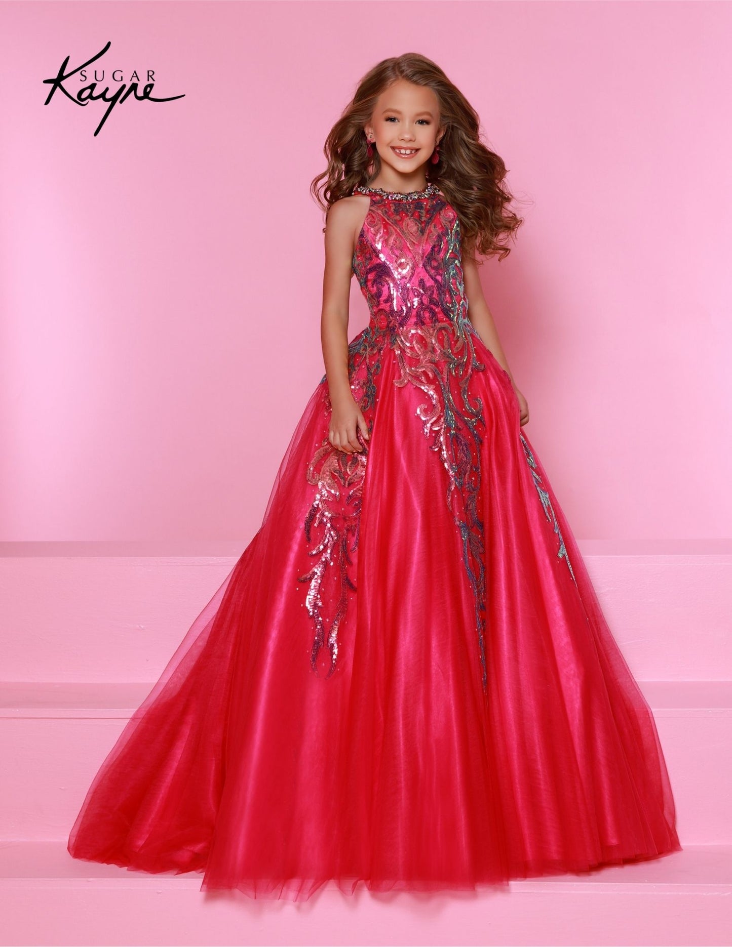 This Sugar Kayne C344 Preteen Pageant Dress is the perfect choice for any special occasion. The dress features a halter neckline, a glittering sequin bodice, and an A-line skirt. Its classic design and streamlined silhouette bring a timeless elegance to any event. Glittering Grace! This Sequin Mesh Ballgown and halter-style neckline ensure you will captivate the audience with grace and style!