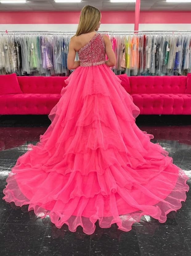 Introducing the Samantha Blake 1025 Girls Long Pageant Dress. Made with Chiffon Ruffle layers and a one shoulder design, this gown exudes elegance and sophistication. Perfect for formal events and pageants, your little girl will shine and feel like a princess in this stunning dress.&nbsp;