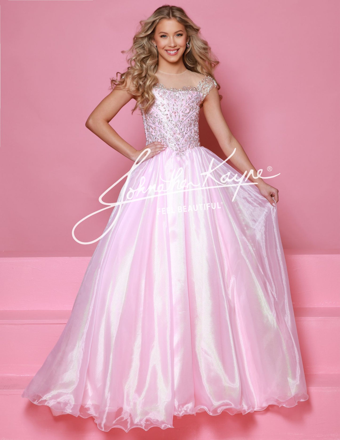  This Sugar Kayne C357 Girls Pageant Dress is a stunning ballgown that will make your little girl stand out on stage. The off the shoulder design and fringe detailing add a touch of glamour, while the shimmer fabric gives the dress a beautiful shine. Perfect for formal events and pageants.