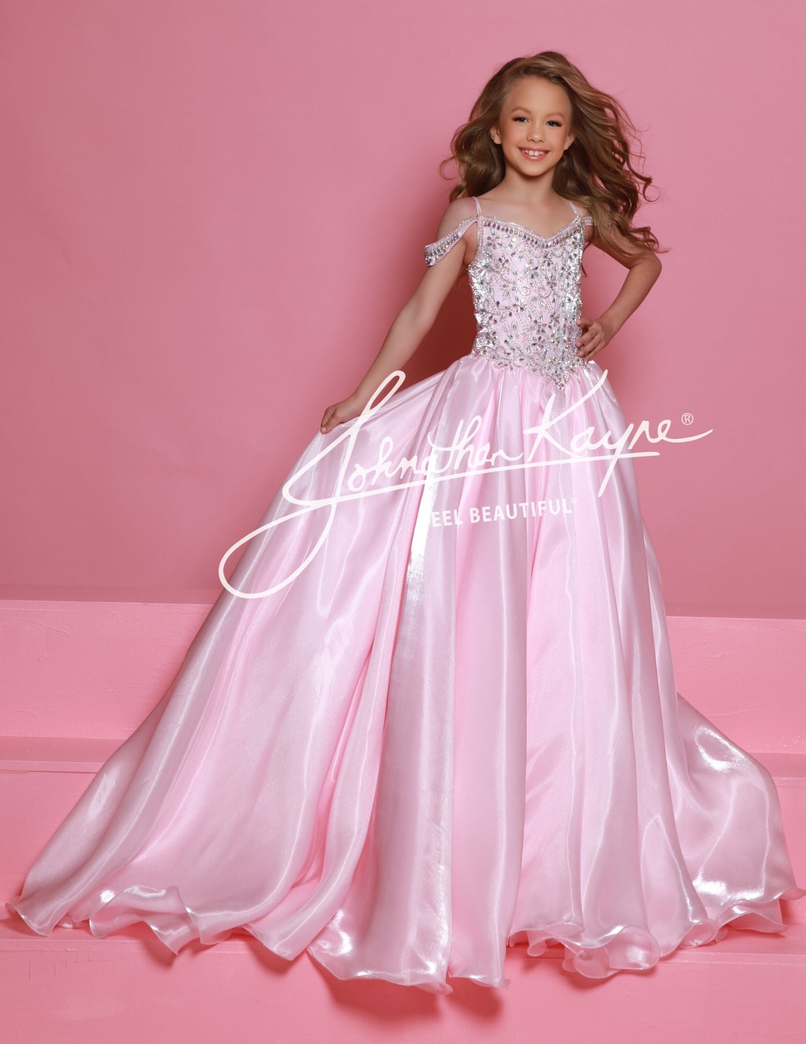 Sugar Kayne C365 Mirror Organza Girls Pageant Dress Off the Shoulder Straps Embellished BodiceElevate your child's pageant look with the Sugar Kayne C365 Organza Girls Pageant Dress. The off-the-shoulder design and crystal bodice add a touch of elegance and sparkle. Made from high-quality organza, this formal gown is not only beautiful but also comfortable for your little one to wear. Perfect for any pageant or special event.