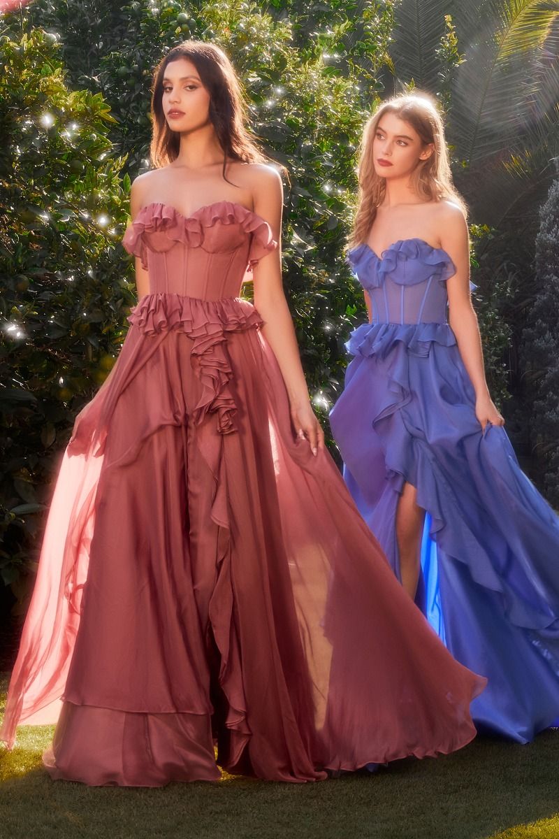 The Andrea & Leo Couture A1341 is a stunning chiffon formal dress that features elegant ruffles and a sheer corset design. The maxi length offers a flowy and sophisticated look, while the slit adds a touch of sensuality. Perfect for bridesmaids or any formal occasion. Dance through dreams in our strapless A-line chiffon dress—a romantic reverie crafted for the heart's delight. The sweetheart neckline, adorned with whimsical ruffles, frames the décolletage in a cascade of enchantment. 