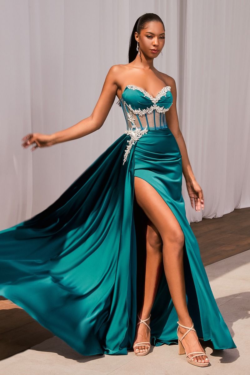 Experience elegance and glamour with the Ladivine CD343 Sheer Corset Satin Slit Prom Dress. This stunning gown features a crystal V-neckline and a strapless design, accentuating your figure. The sheer corset adds a touch of sensuality, while the overskirt adds drama and movement. Make a statement at your next special event with this eye-catching dress. Feel like a goddess in this breathtaking satin evening gown!