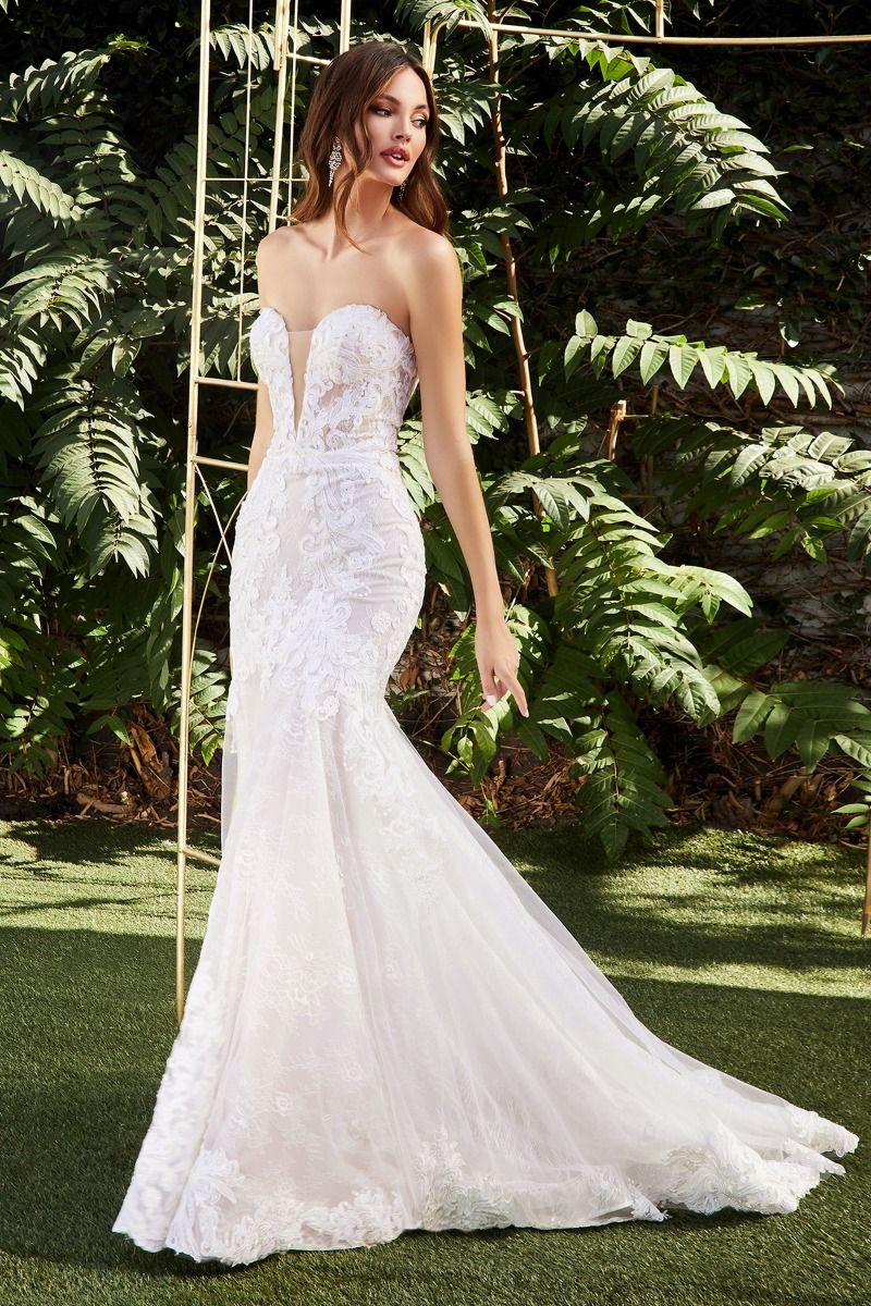 Look like a dream in the Ladivine CD928 long lace mermaid wedding dress. Featuring a stunning lacework that cinches the waist, corset bodice, and scallops at the hem, this gown creates an hourglass silhouette that is perfect for the special bride. The removable back tail allows for an elegant look during the ceremony and a more relaxed look for the reception. Make your wedding day extra special with the Ladivine CD928.