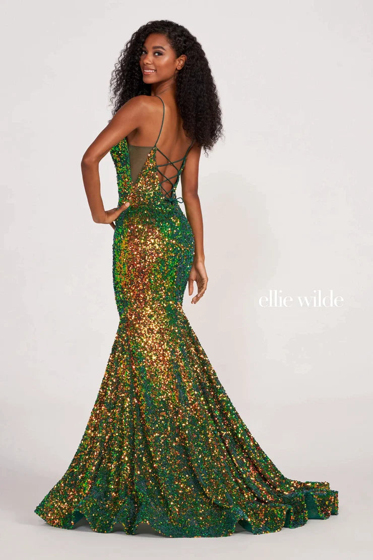 Look sophisticated and graceful in Ellie Wilde EW34016. The signature Iridescent color shifting sequins and mermaid silhouette make this timeless corset dress a perfect choice for a formal occasion. Captivate everyone in the room with its sparkling iridescent material and backless v-neckline.  Sizes: 8  Colors: IRIS  https://dy9ihb9itgy3g.cloudfront.net/static/themes/EllieWilde/Spring_2023/EW34016.mp4