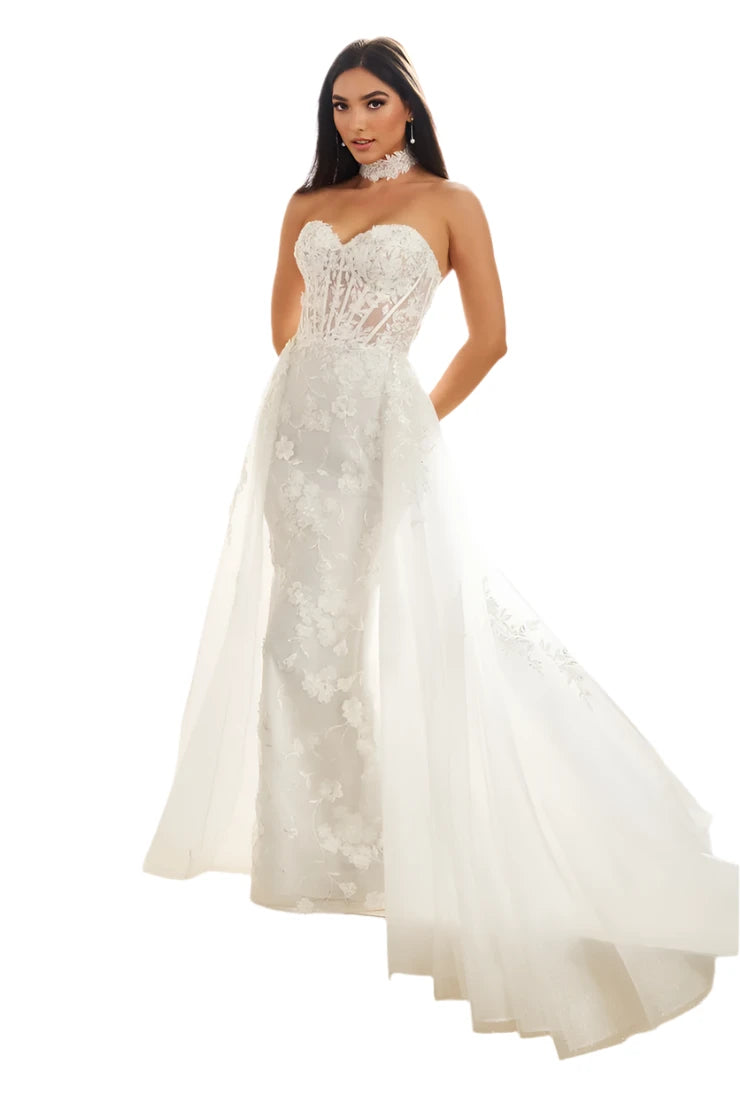 Luxurious and elegant, the Ellie Wilde EW36028 wedding dress is designed for the modern bride. The sequin lace shimmer adds a touch of glamour, while the overskirt and corset create a dramatic silhouette. The sheer choker adds a hint of mystery. Perfect for a reception or bridal event, this dress will make you stand out in any colored theme.

Sizes: 00-24

Colors: Black, Ivory, Petal