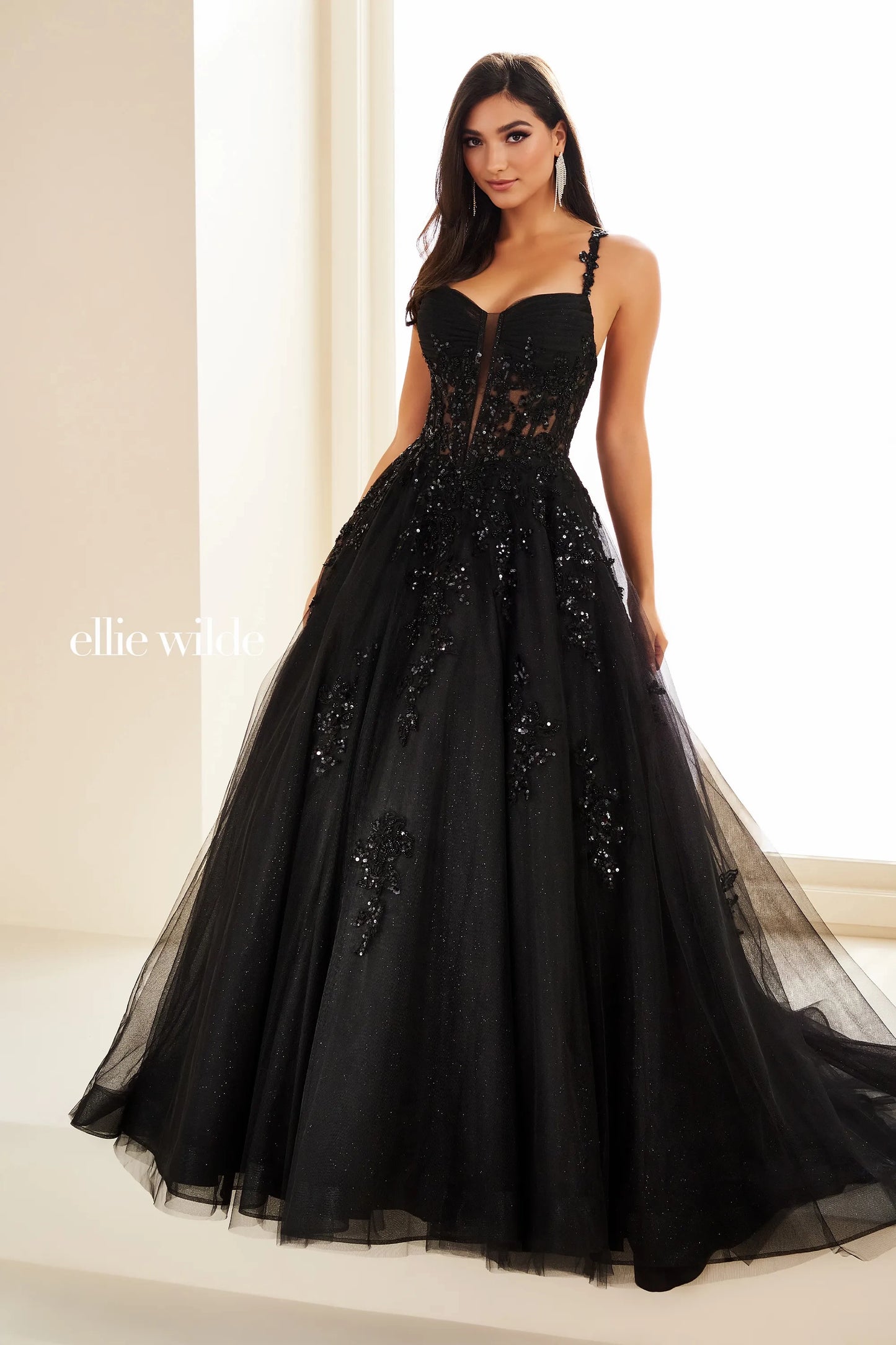 Unleash your inner glamour with the Ellie Wilde EW36202 Prom Dress. Made with shimmering sequin lace and a sheer corset, this dress is designed to make you stand out. The elegant ball gown silhouette and formal design will ensure you feel confident and sophisticated for any formal occasion.