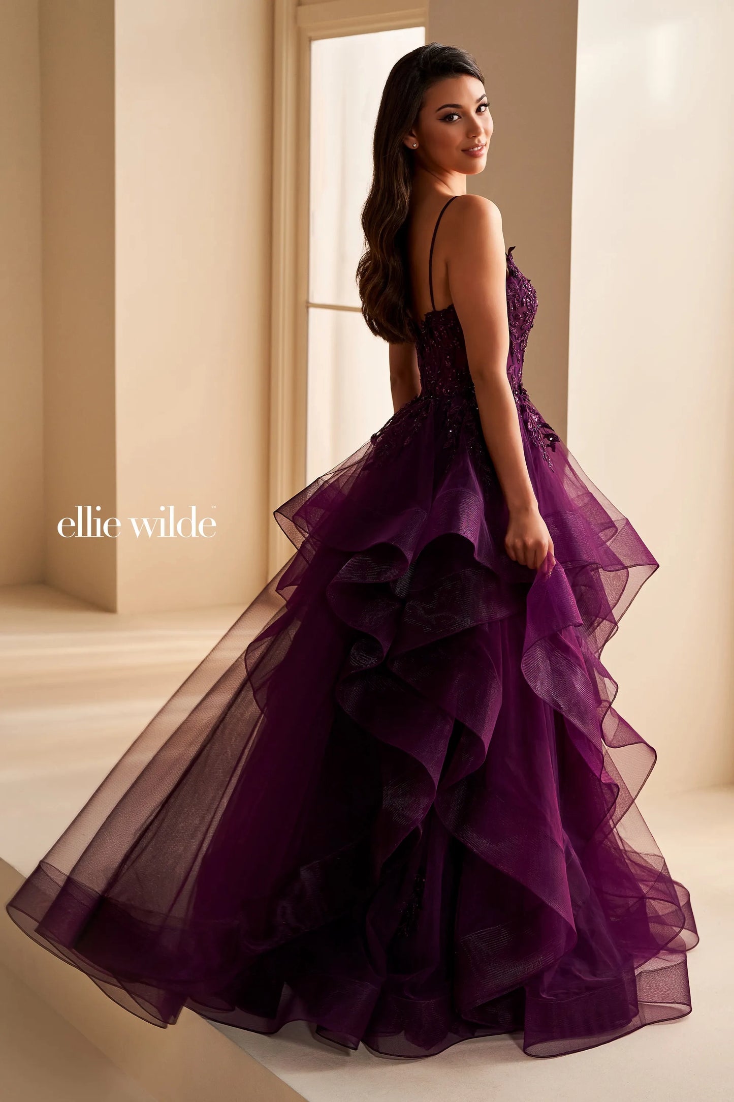 Step into elegance with the Ellie Wilde EW36225 Sheer Lace Corset Ball Gown. Featuring a stunning sheer lace bodice and layered corset, this formal evening gown is perfect for prom or any special occasion. Make a statement in this luxurious and exclusive dress, designed to make you feel like a work of art.